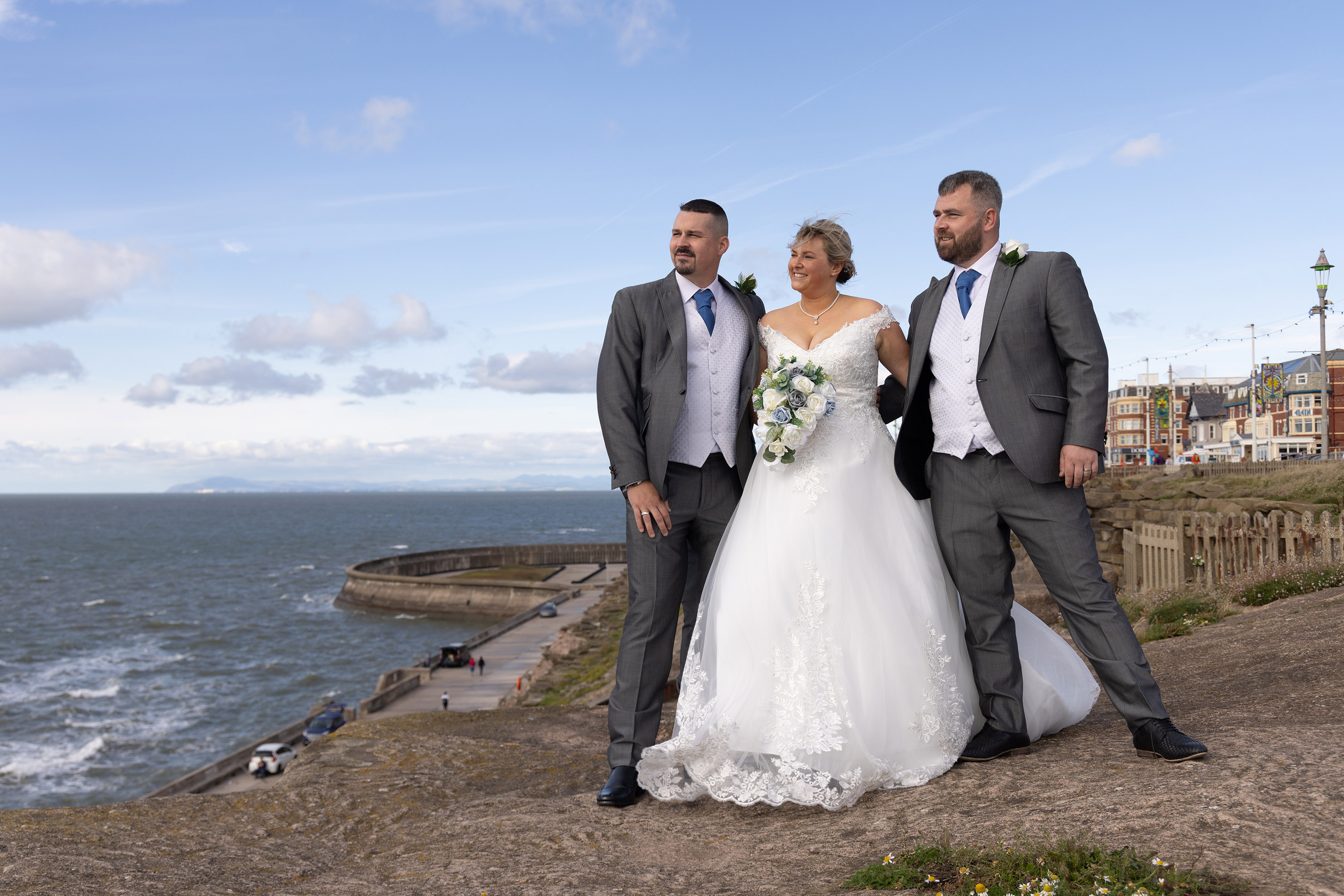 The Brides standing with her husband and brother 