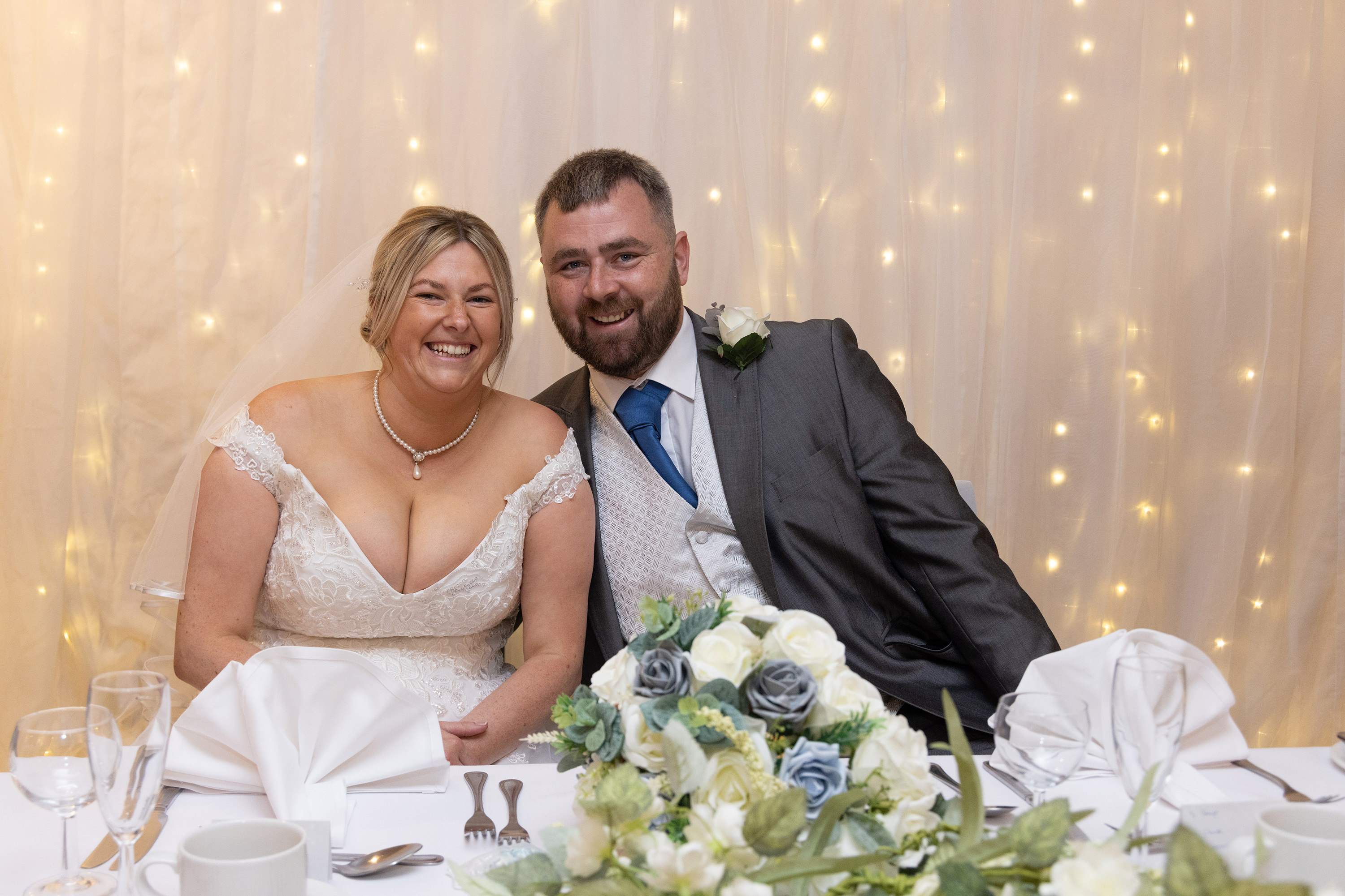 The happy couple sit down for their wedding breakfast