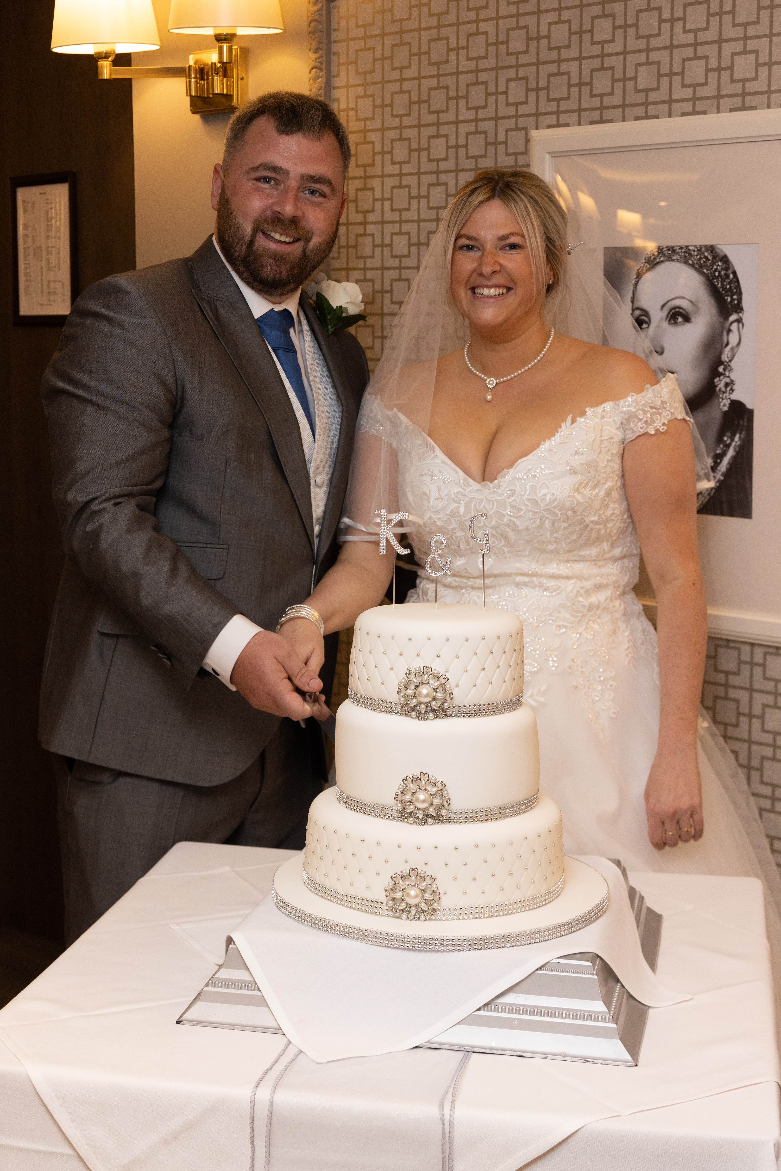 The bride and groom cut the wedding cake at the Sheraton Hotel Blackpoo