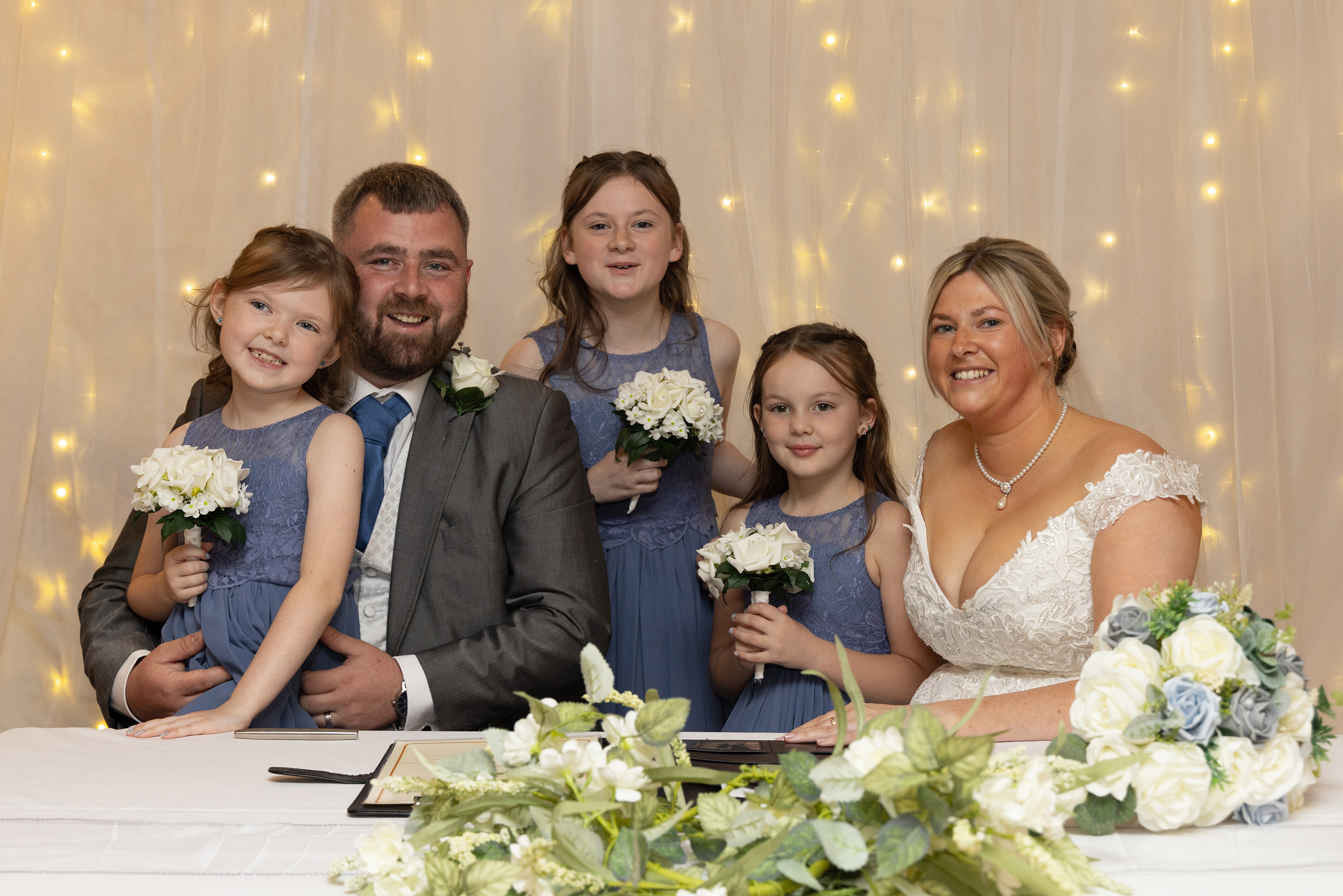 A family photo of the bride and groom and their children at the Sheraton Hotel in Blackpool