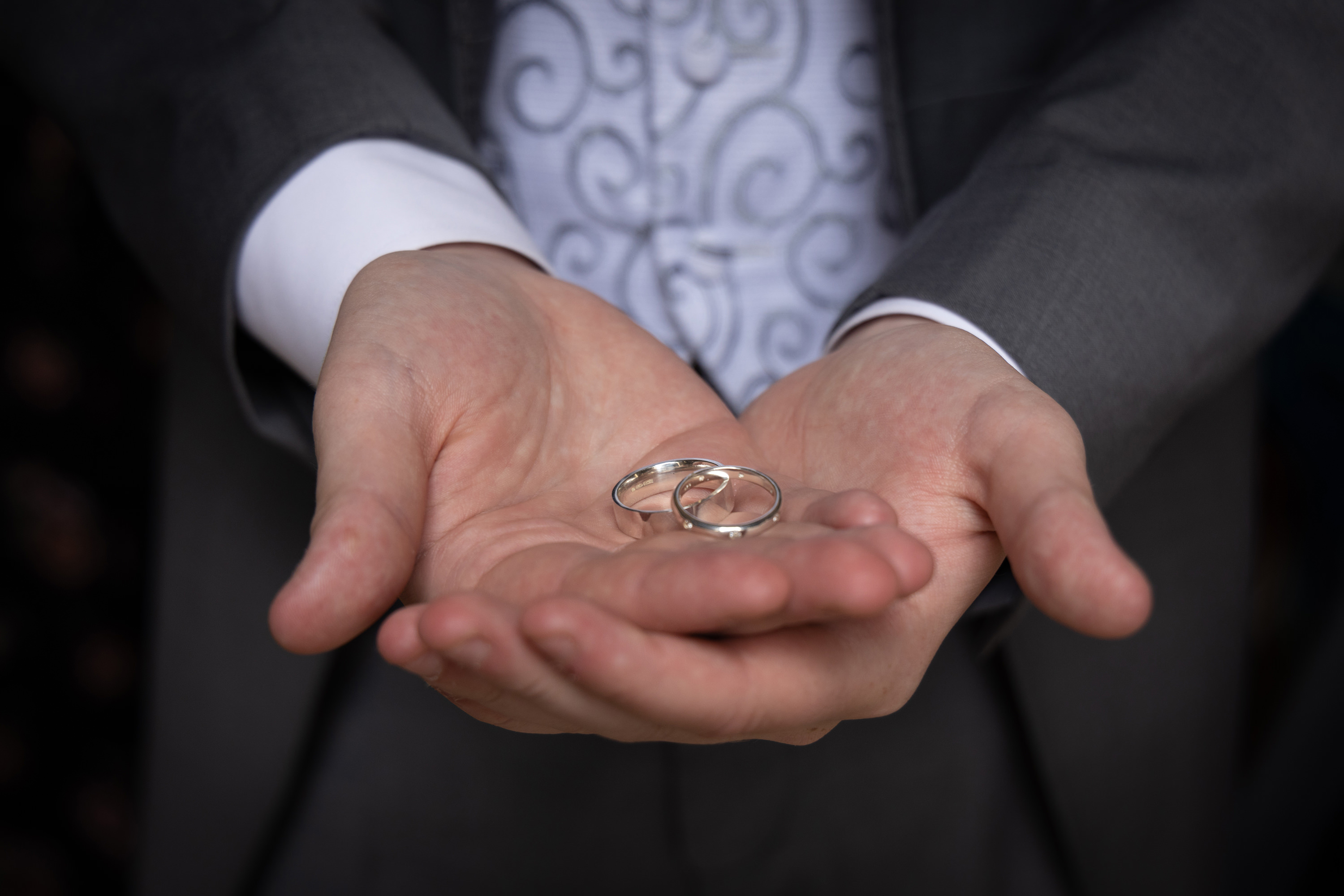 The best man holding the wedding rings