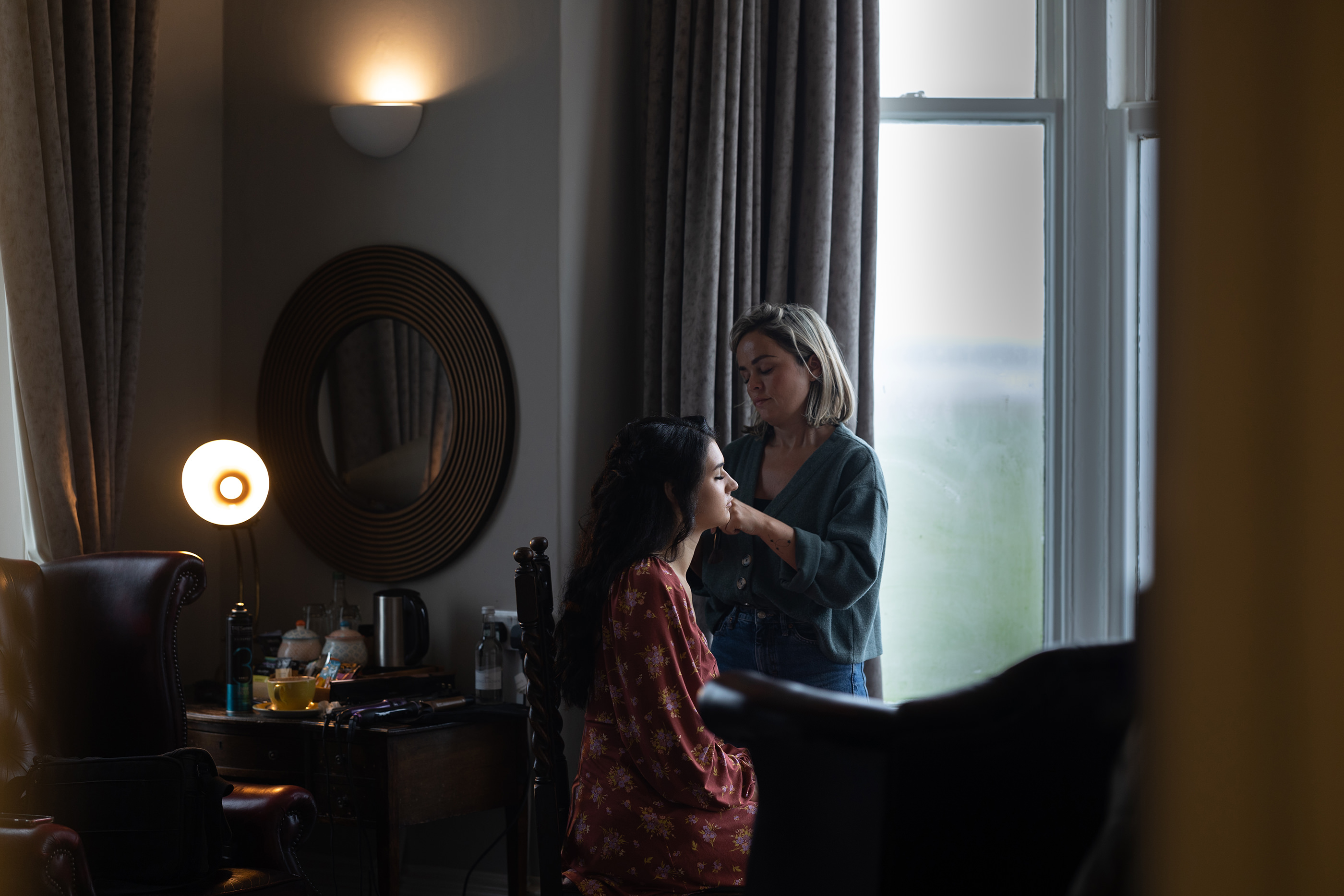 Emily having her hair and make-up done for her wedding 
