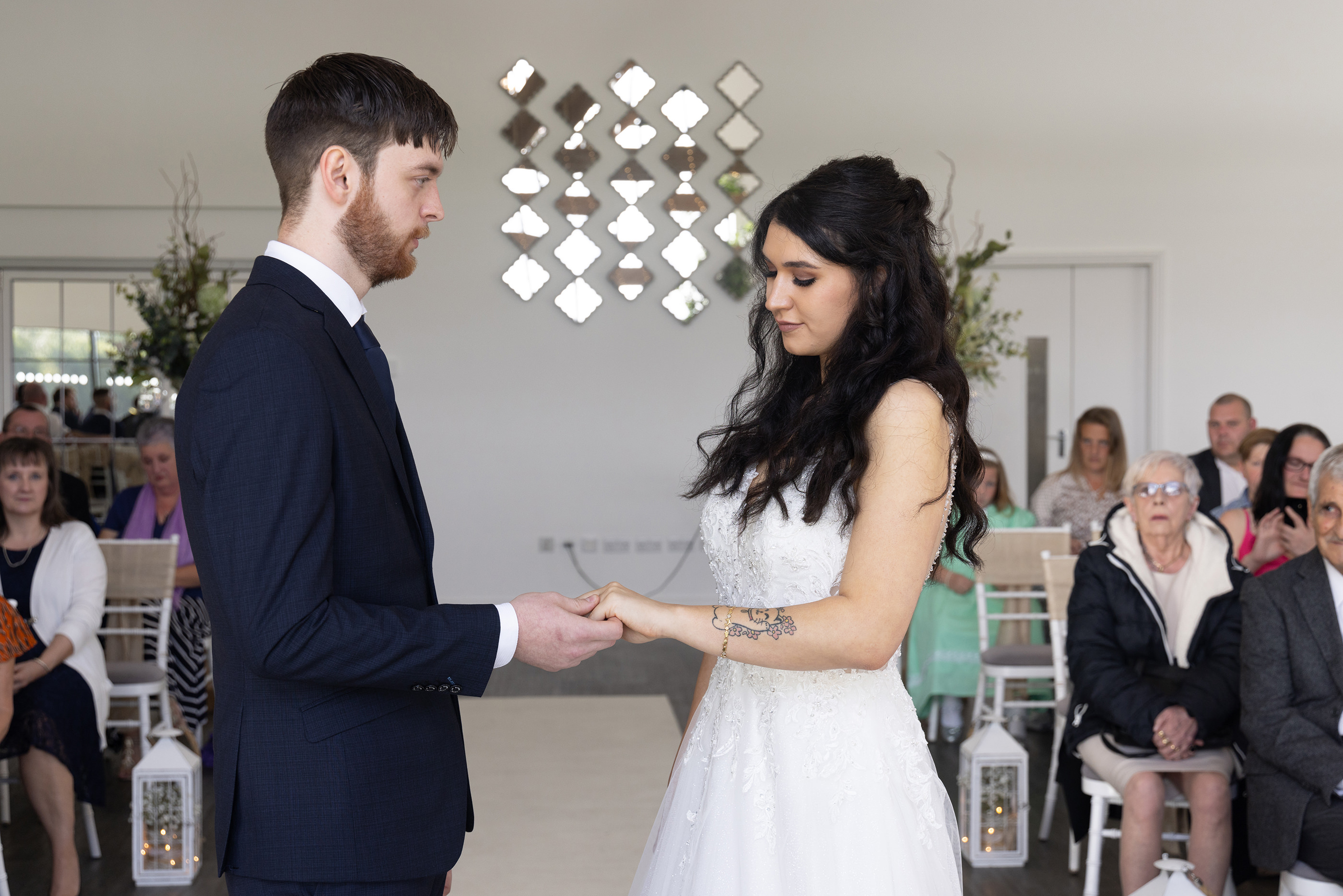 Emily and Neil exchange their wedding rings 