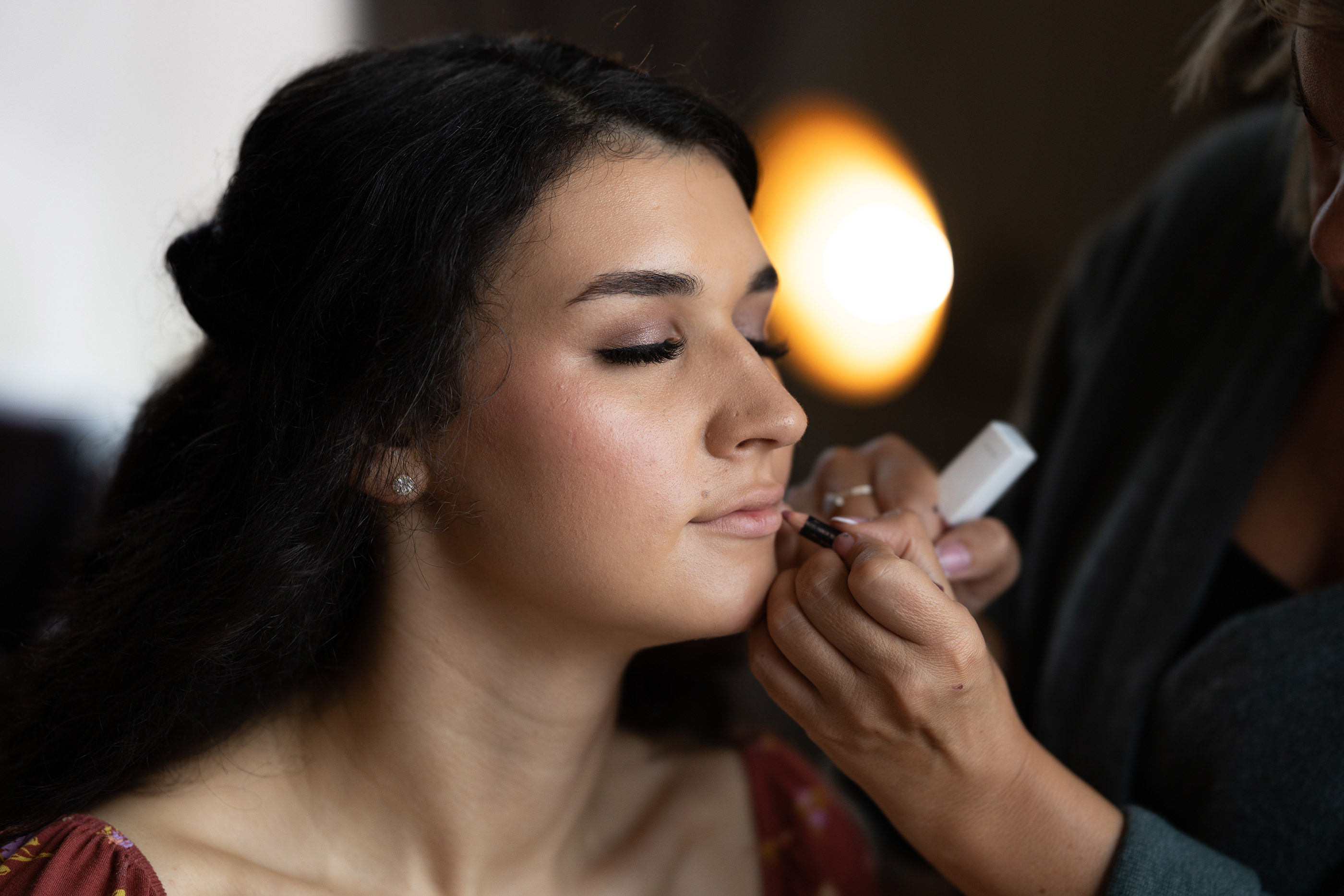 Emily the Bride having her lipstick put on 