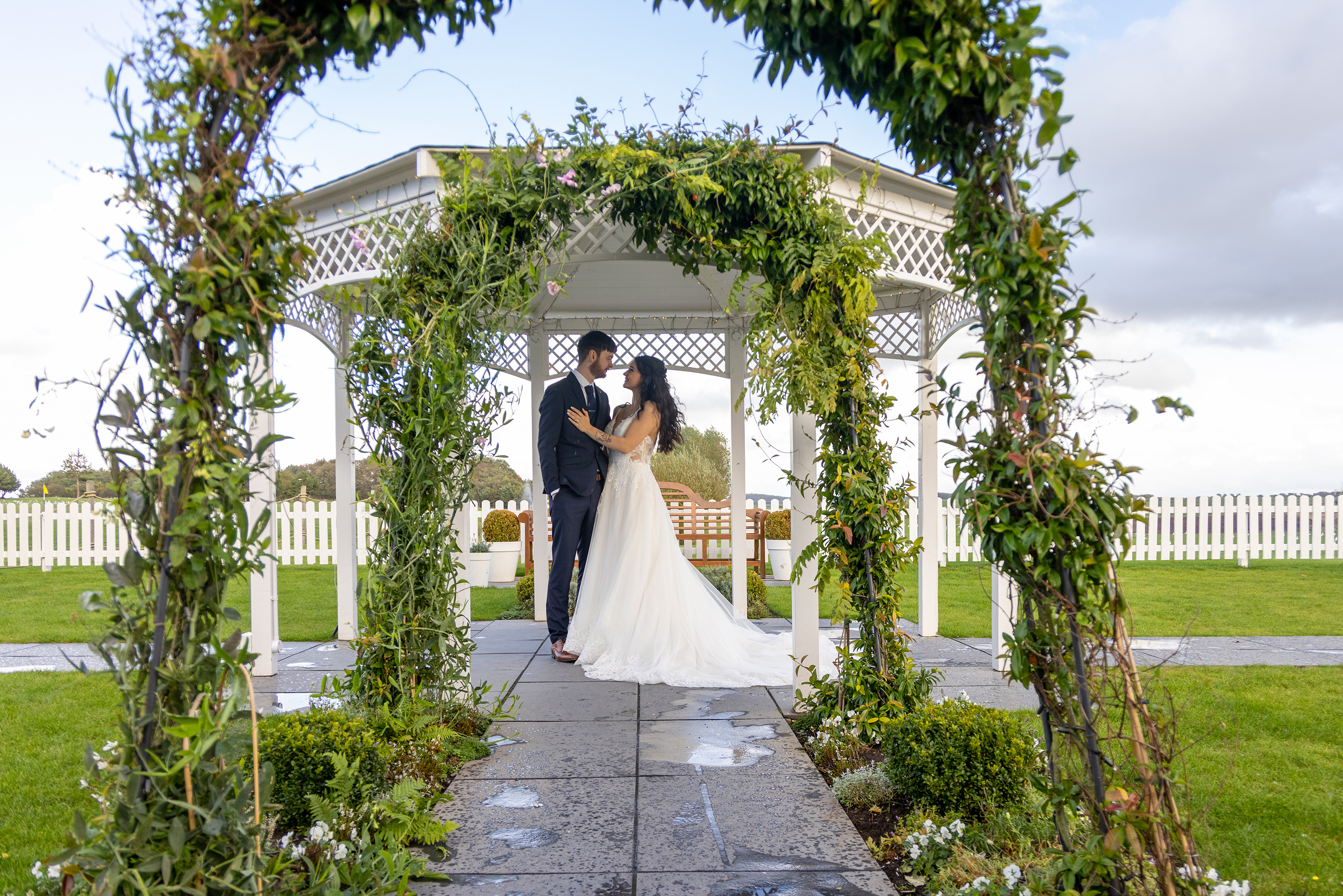 Emily and Neil pose for their wedding photos 
