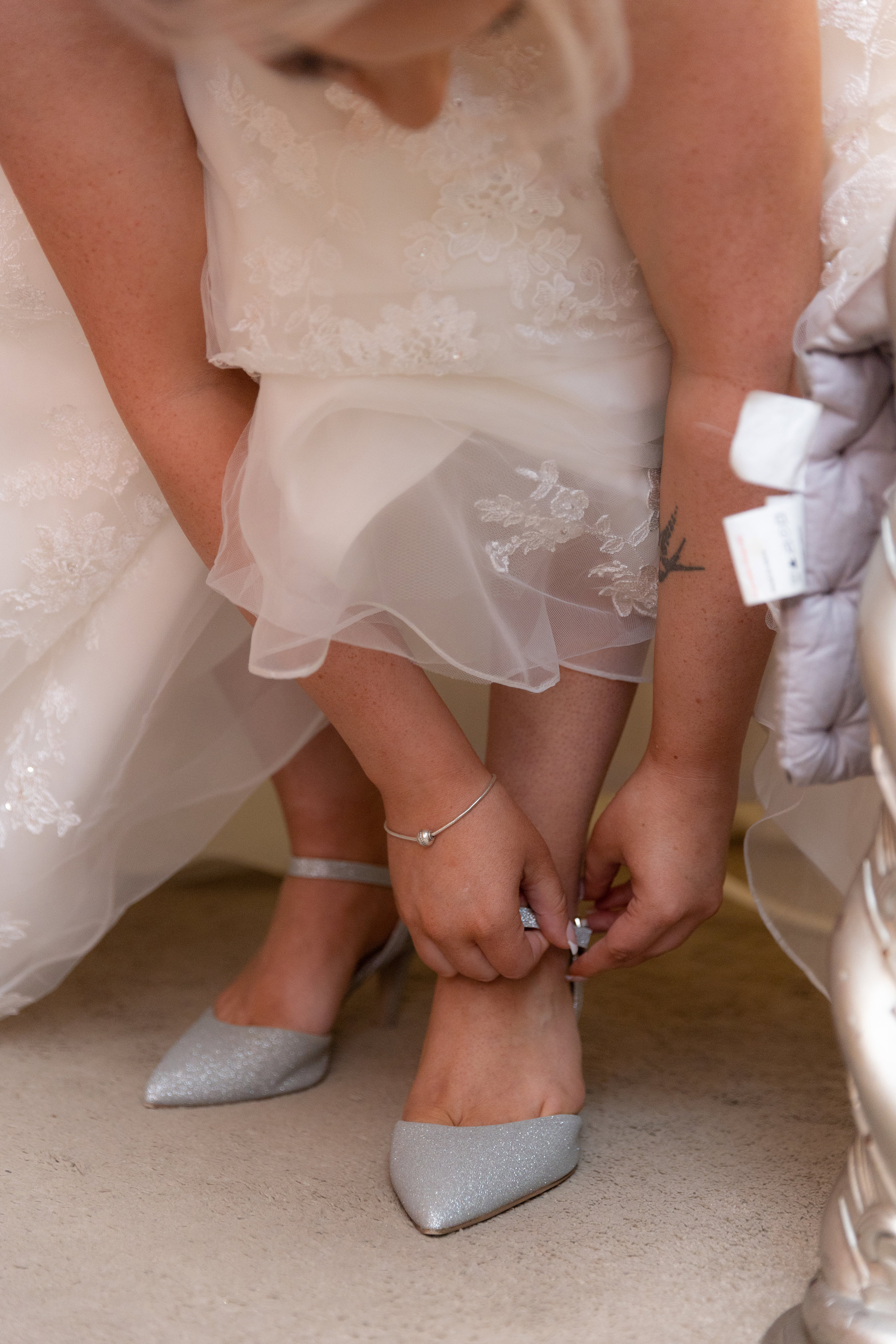 Gemma putting on her wedding shoes