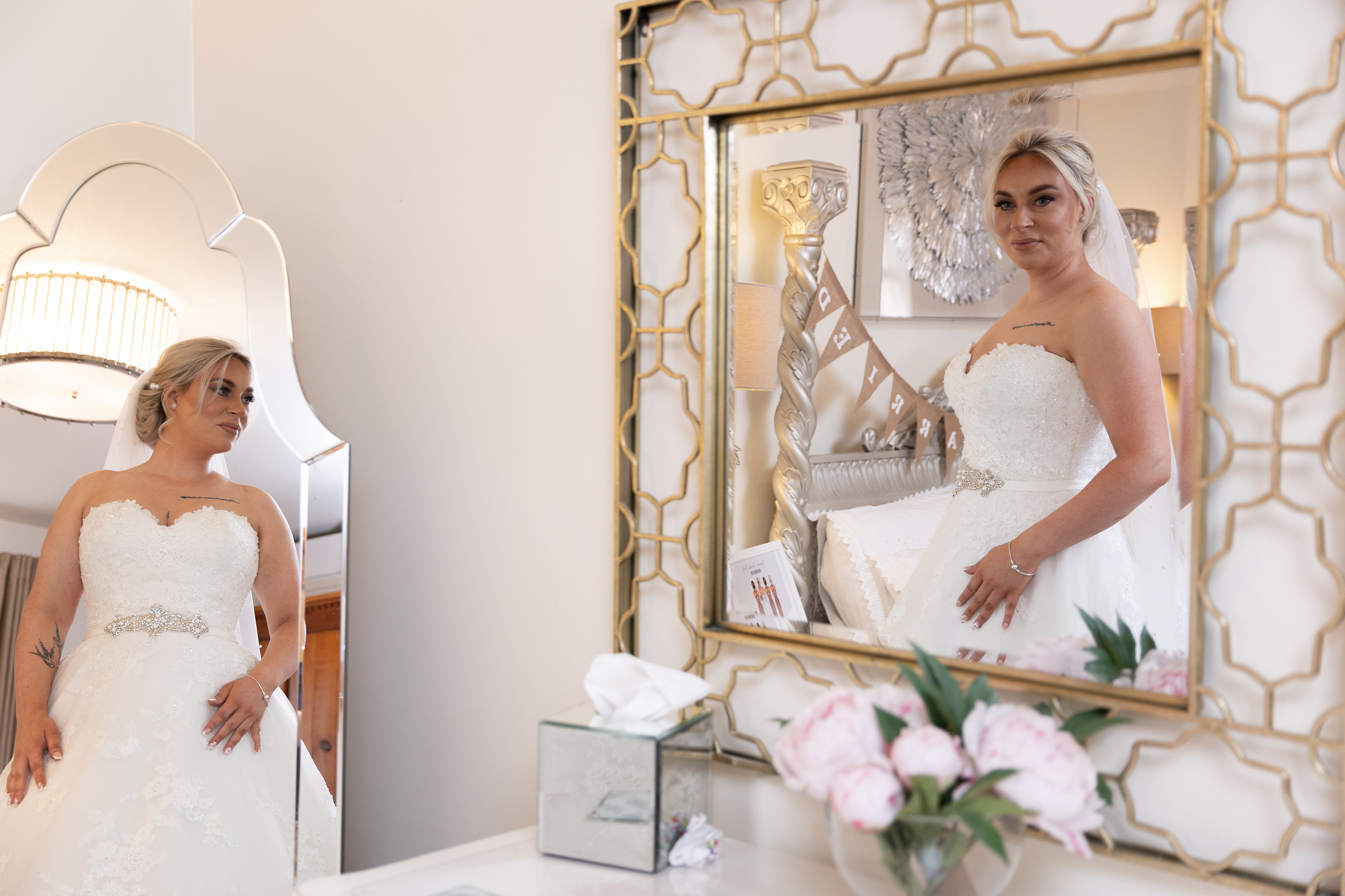 Reflections of the bride in the mirrors at Beeston Manor