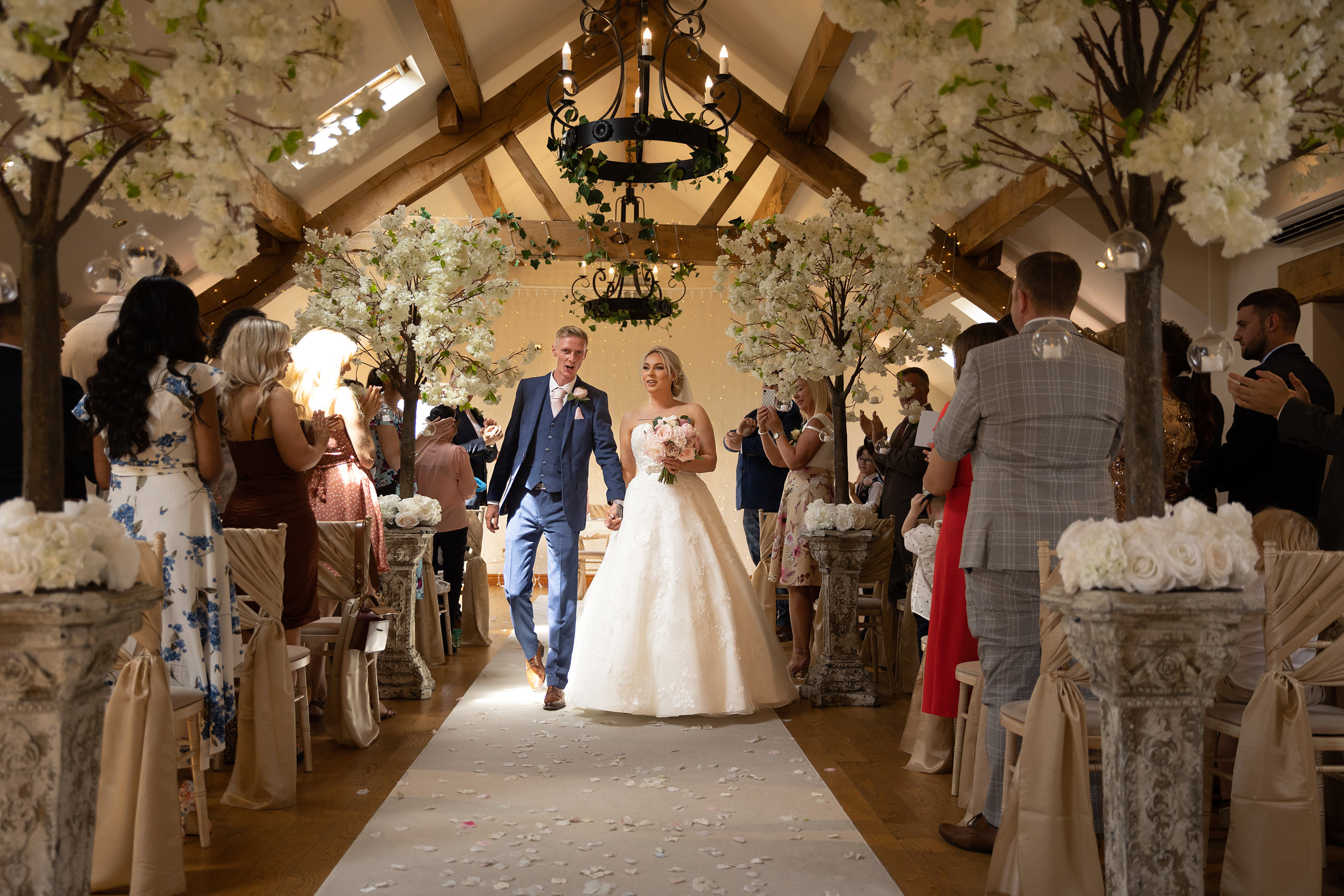 The bride and groom walk down the aisle as husband and wife