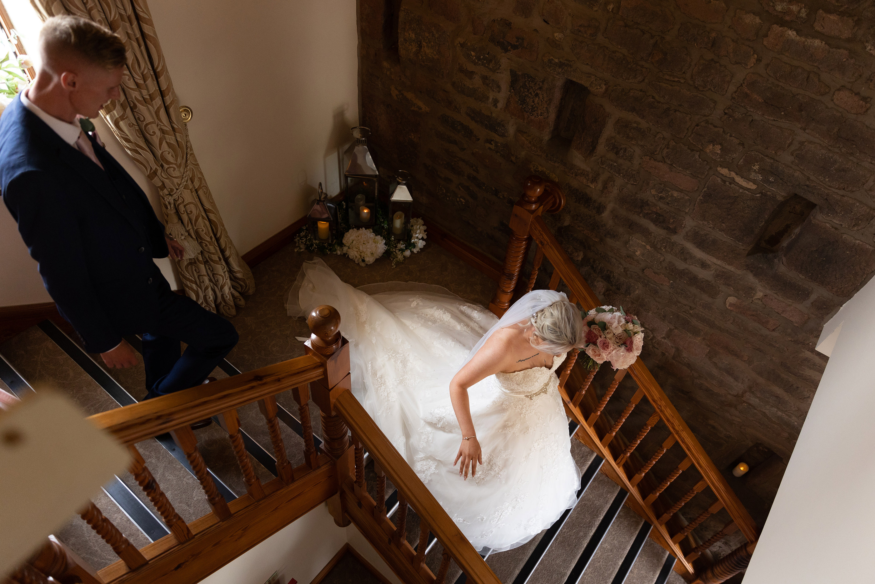 The Bride walks down the staircase 