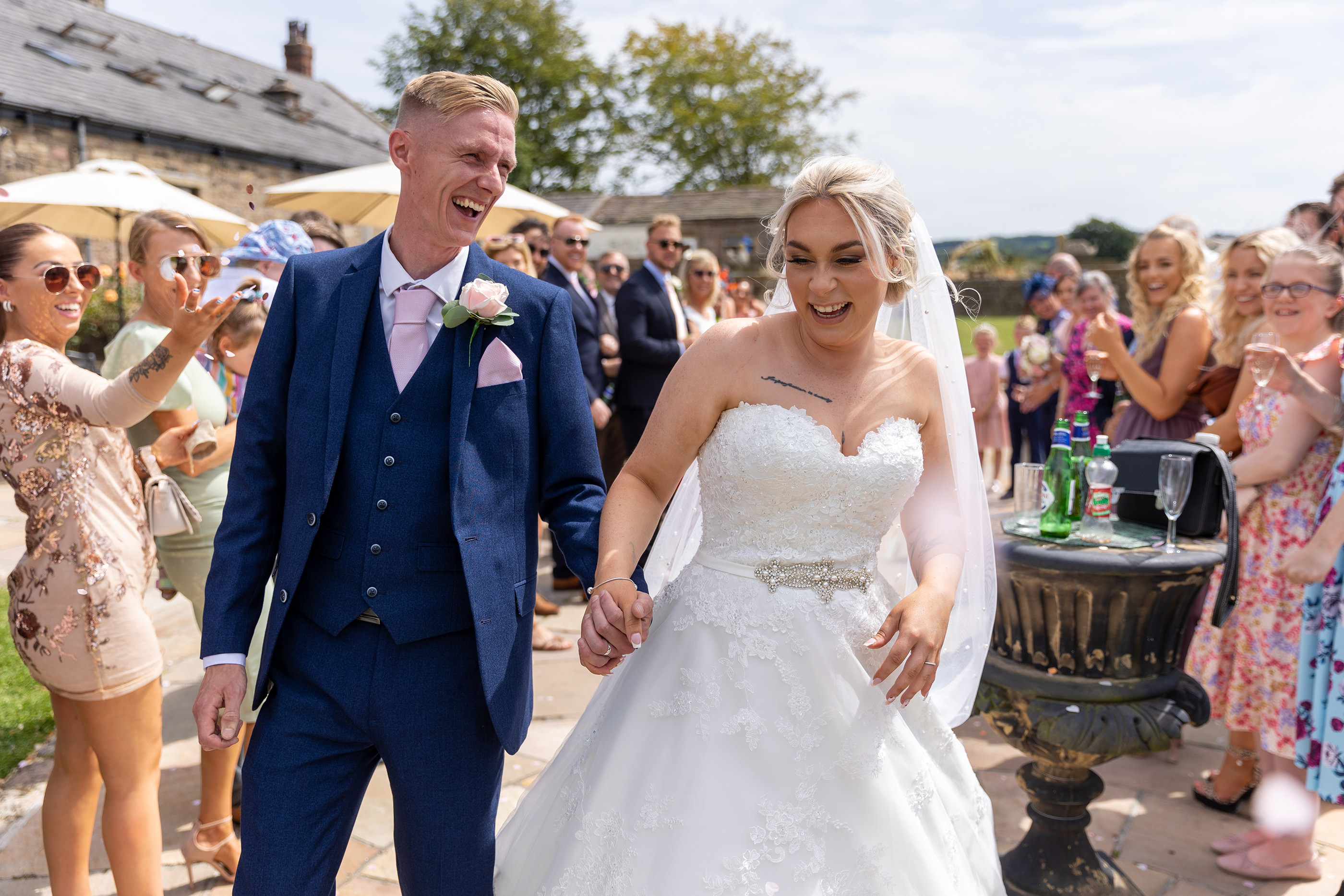 The happy couple laugh together outside Beeston Manor