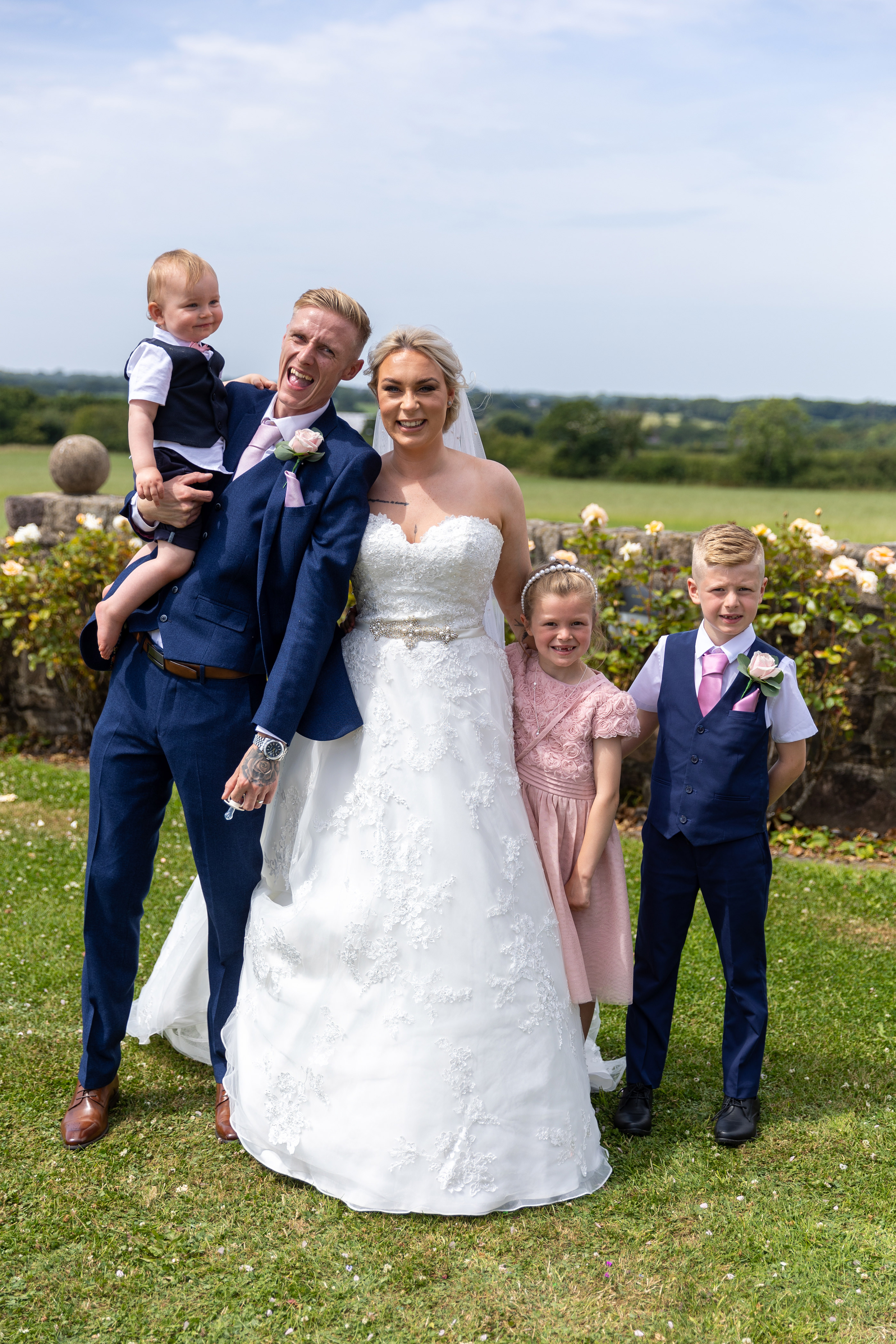 Family photo of the happy couple and their children