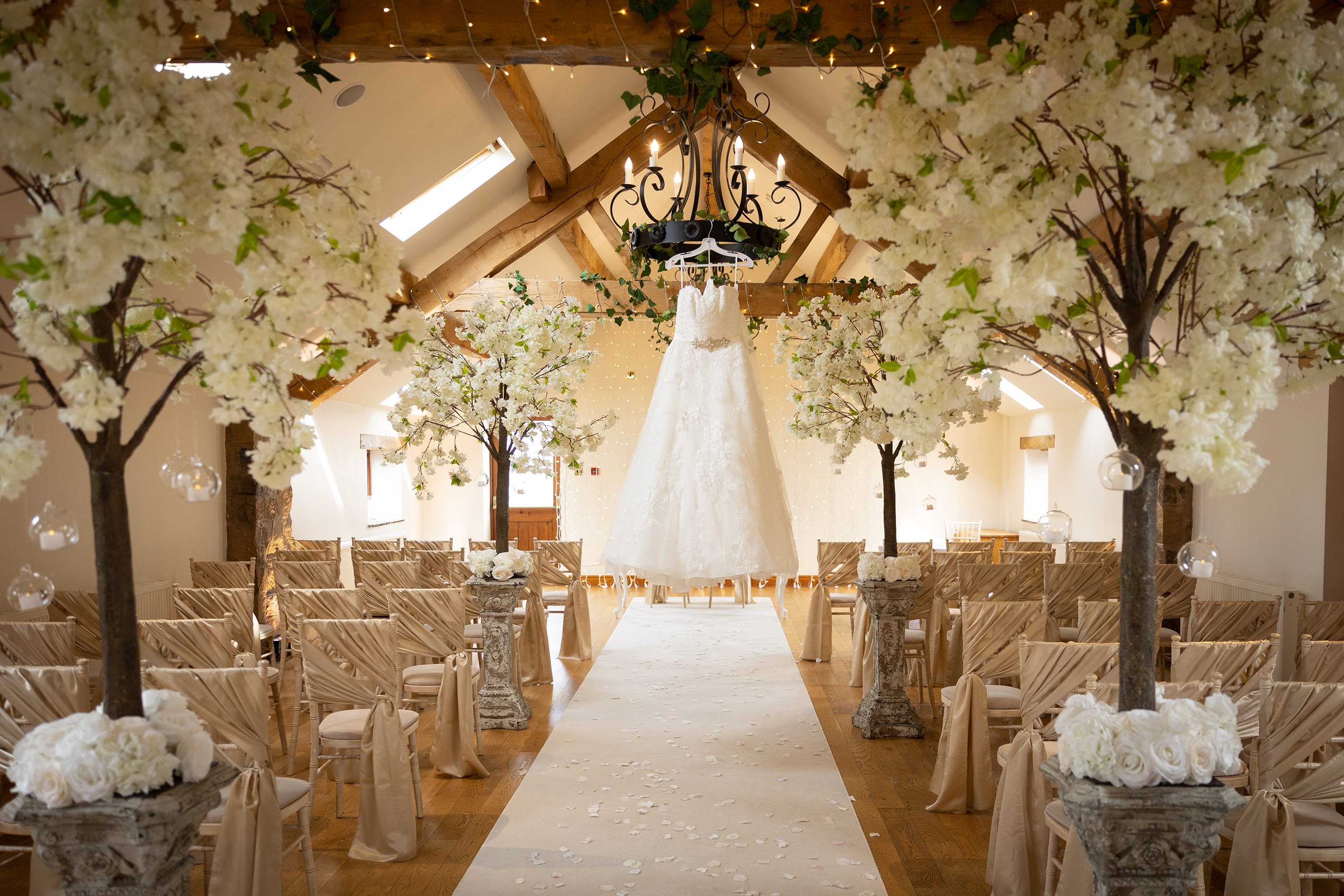 Gemma's wedding dress hanging in the wedding ceremony room