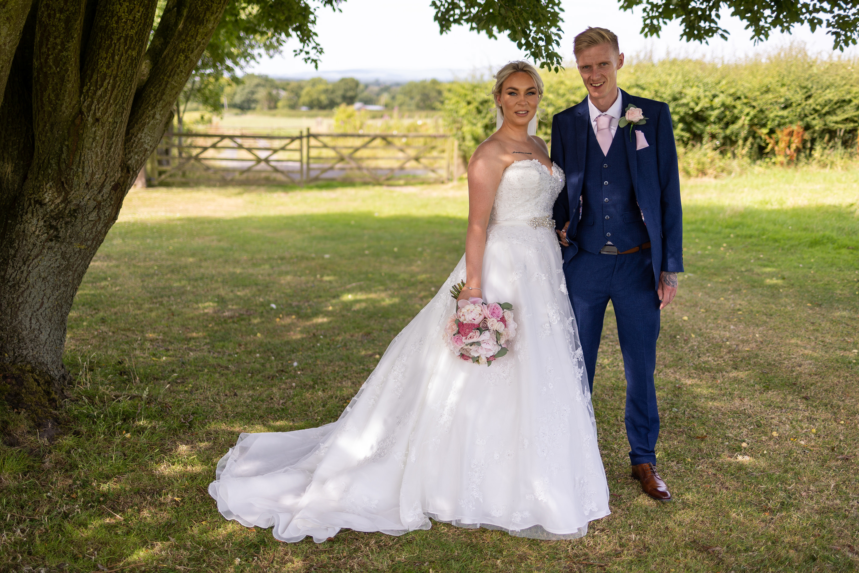 The bride and groom pose for their wedding photos