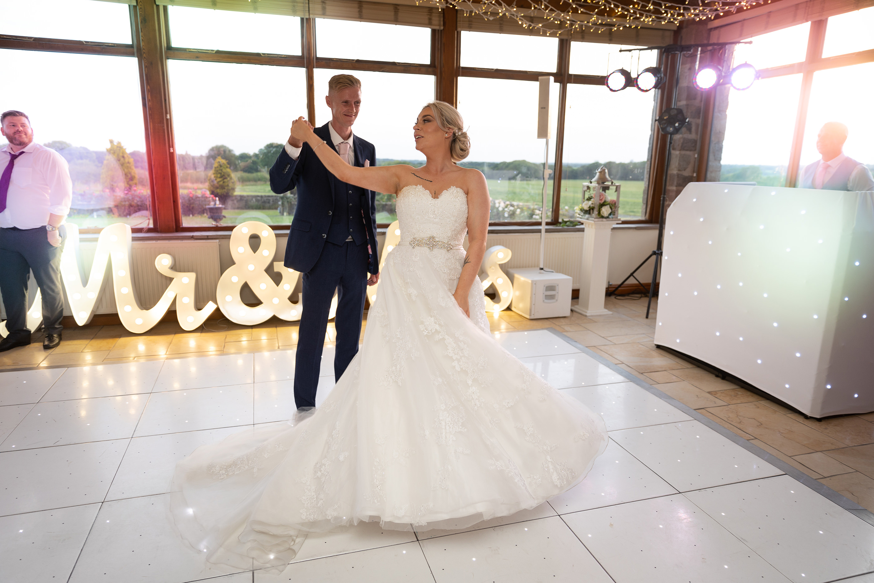 The bride and groom have their first dance