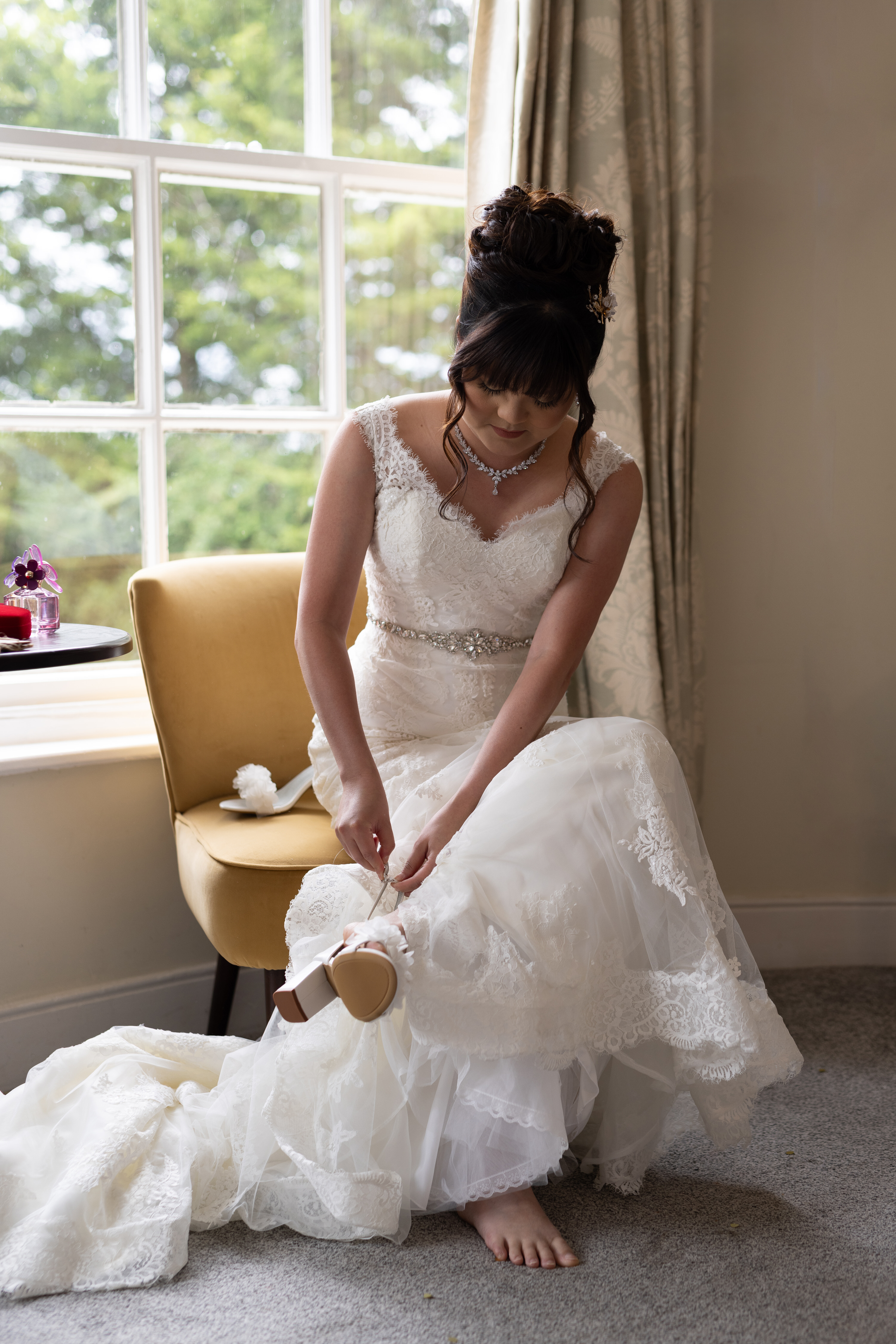 The Bride puts on her wedding shoes 