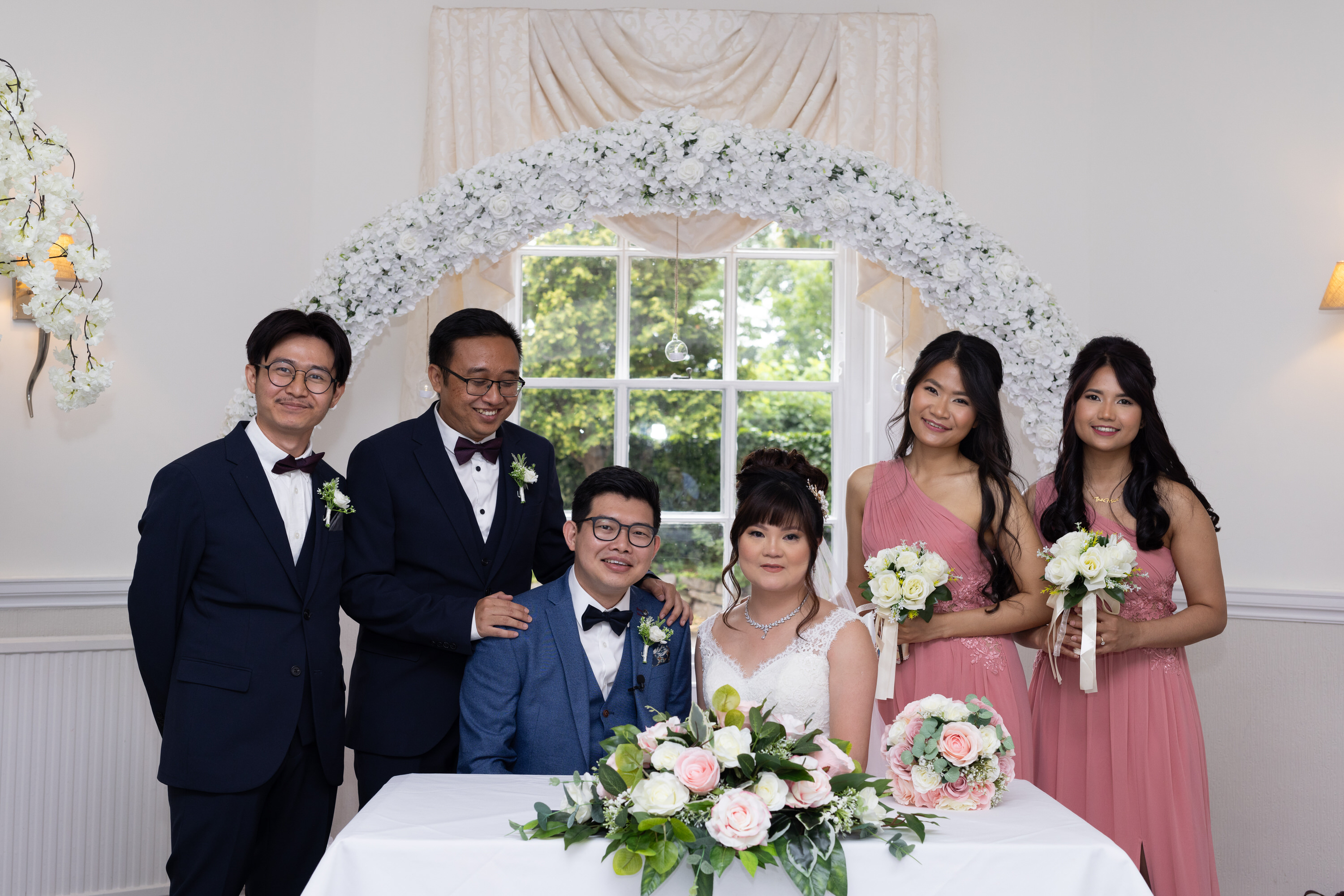 The bride and groom with the bridesmaids and Best Men 