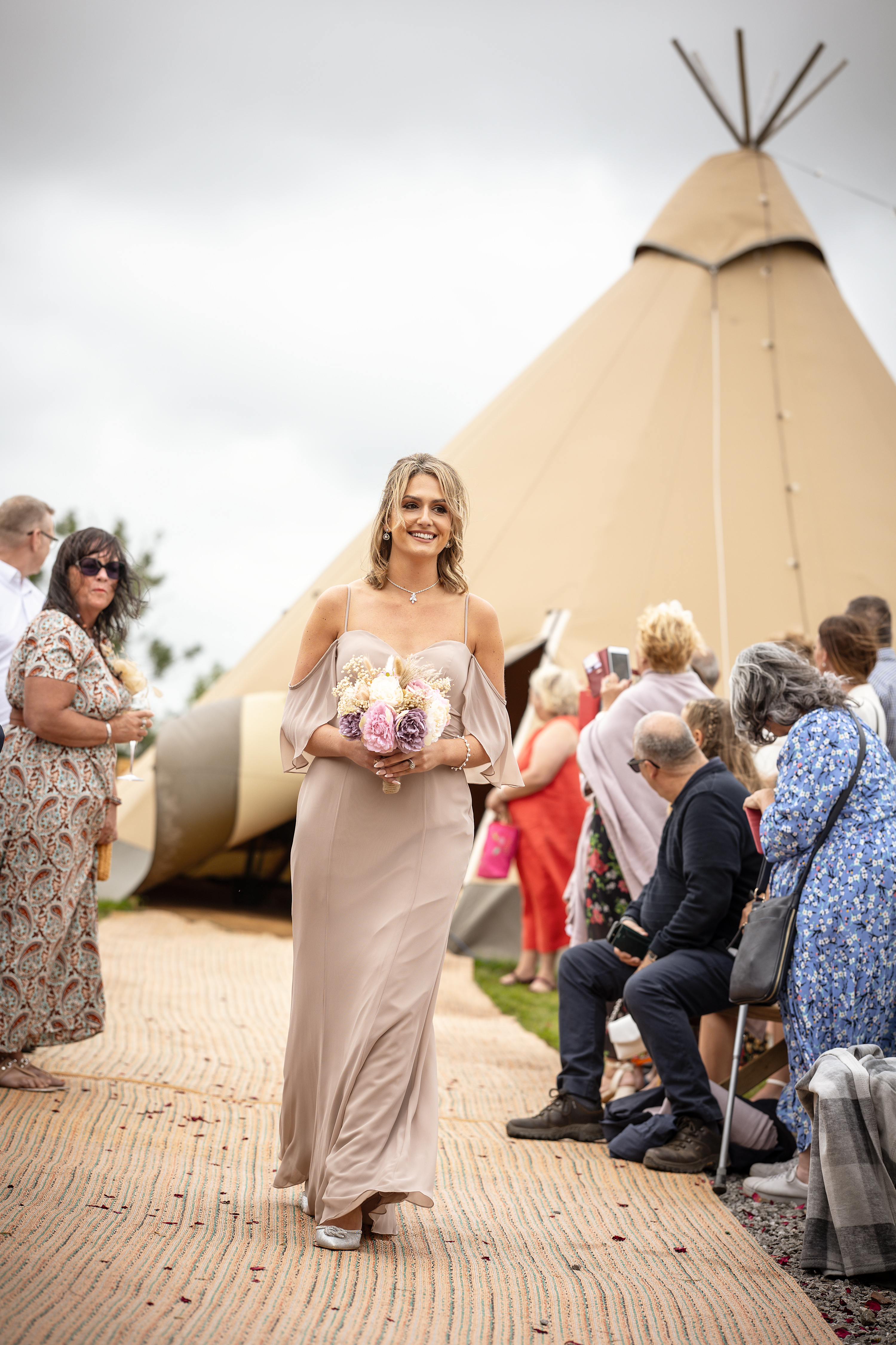 The Bridesmaids looking happy carrying their bouquets