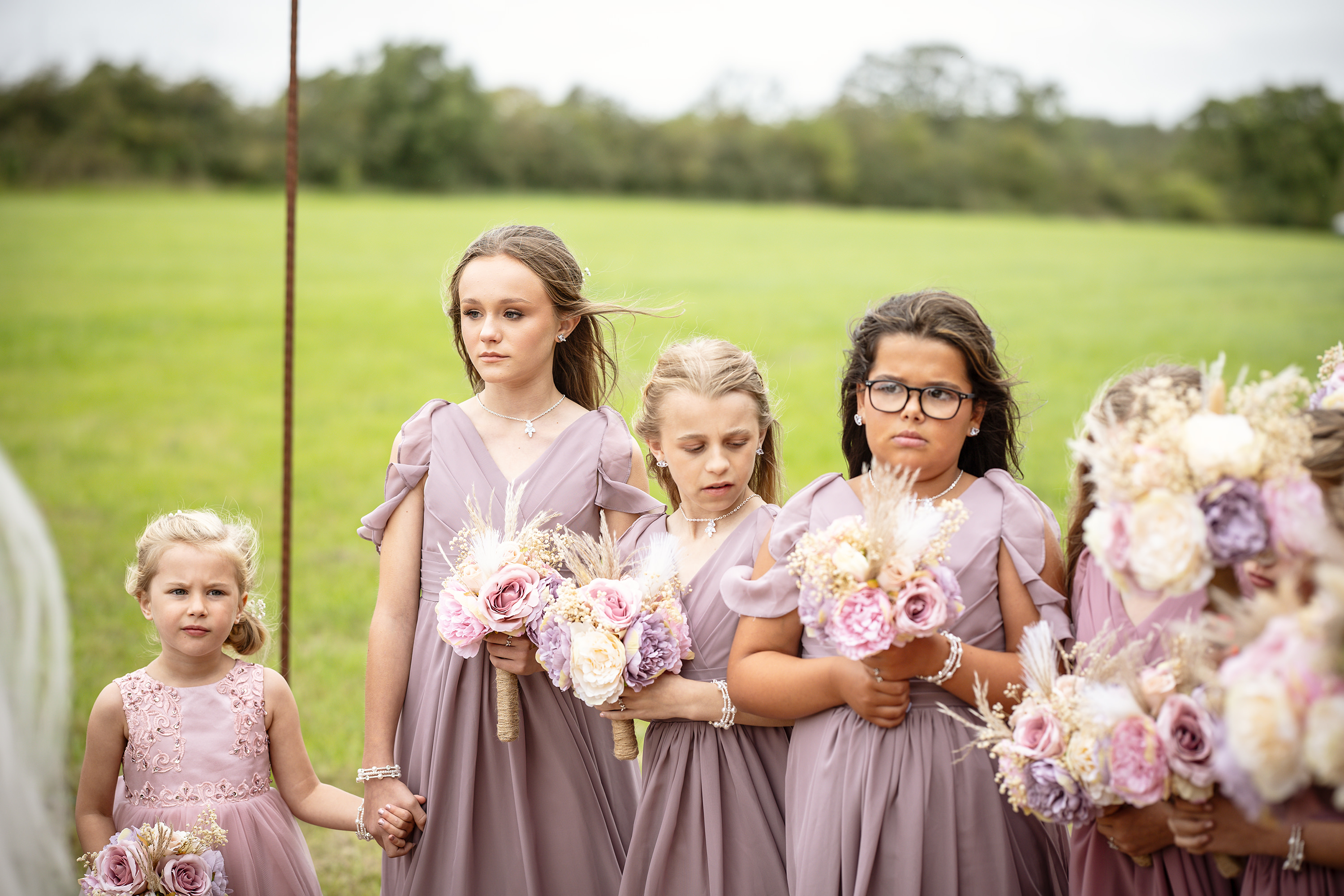 The flower girls looking a bit cold in the wind 
