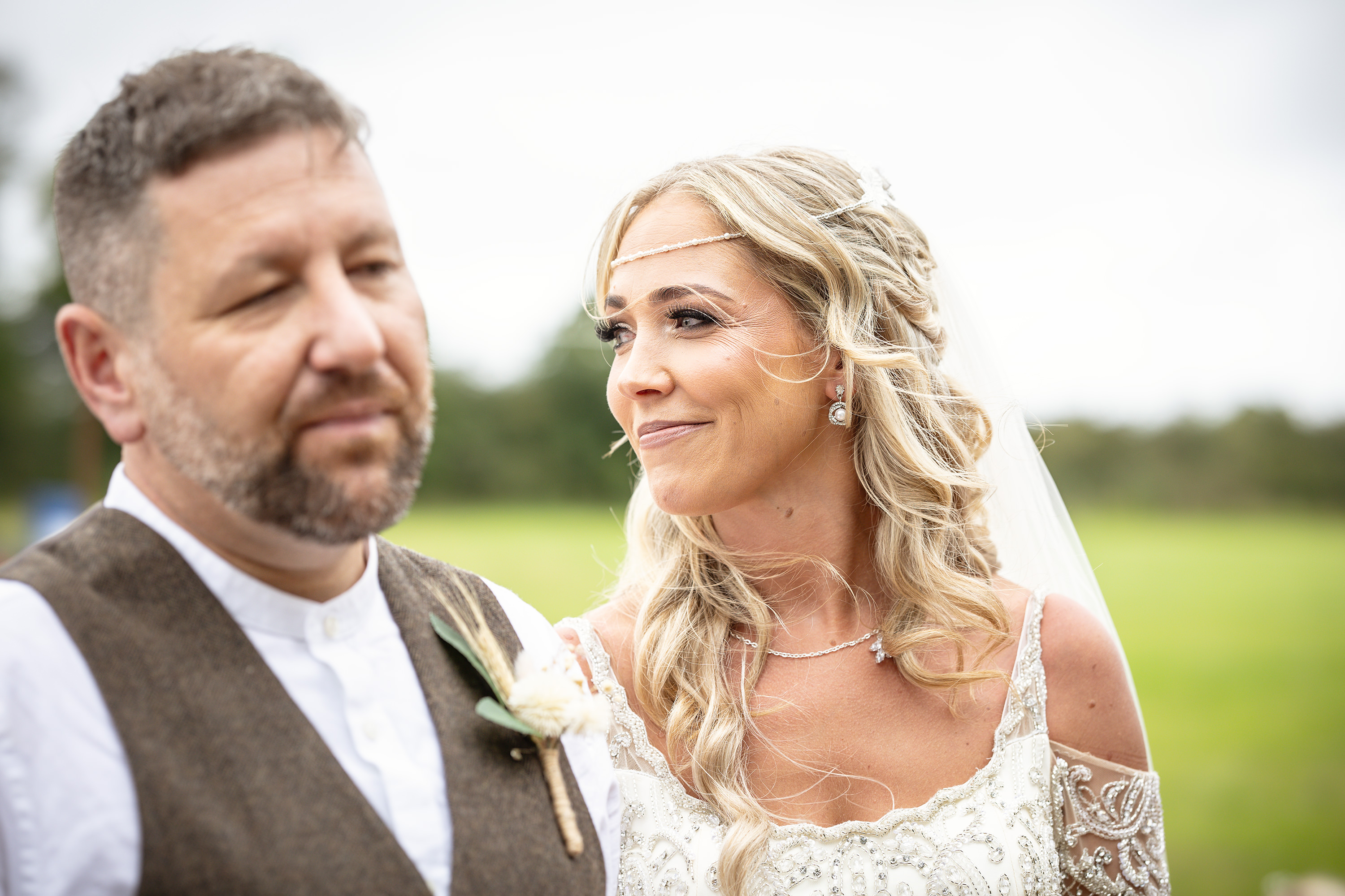 The Bride glances back at her wedding guests 