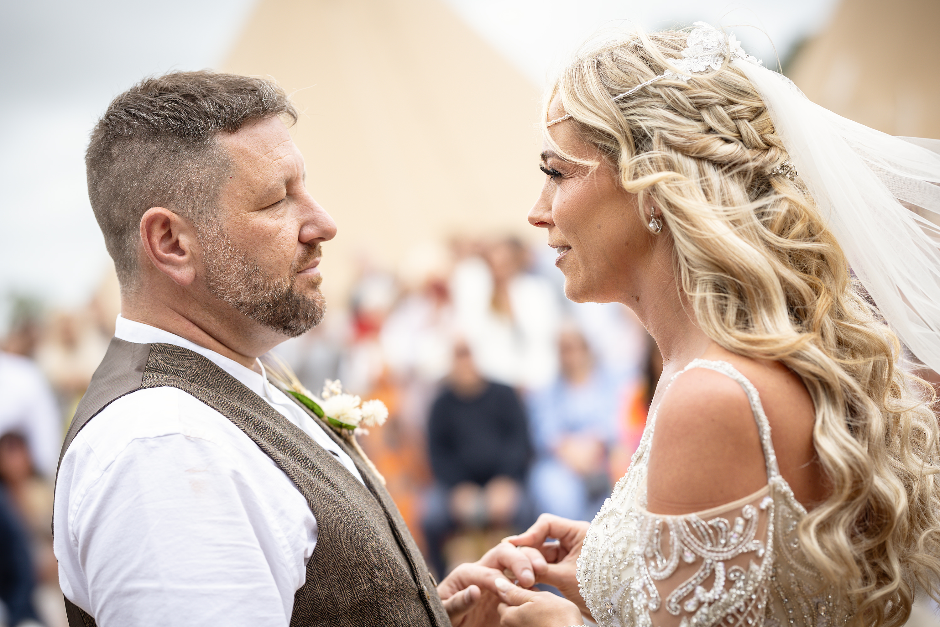 Samantha puts Daley's wedding ring on his finger