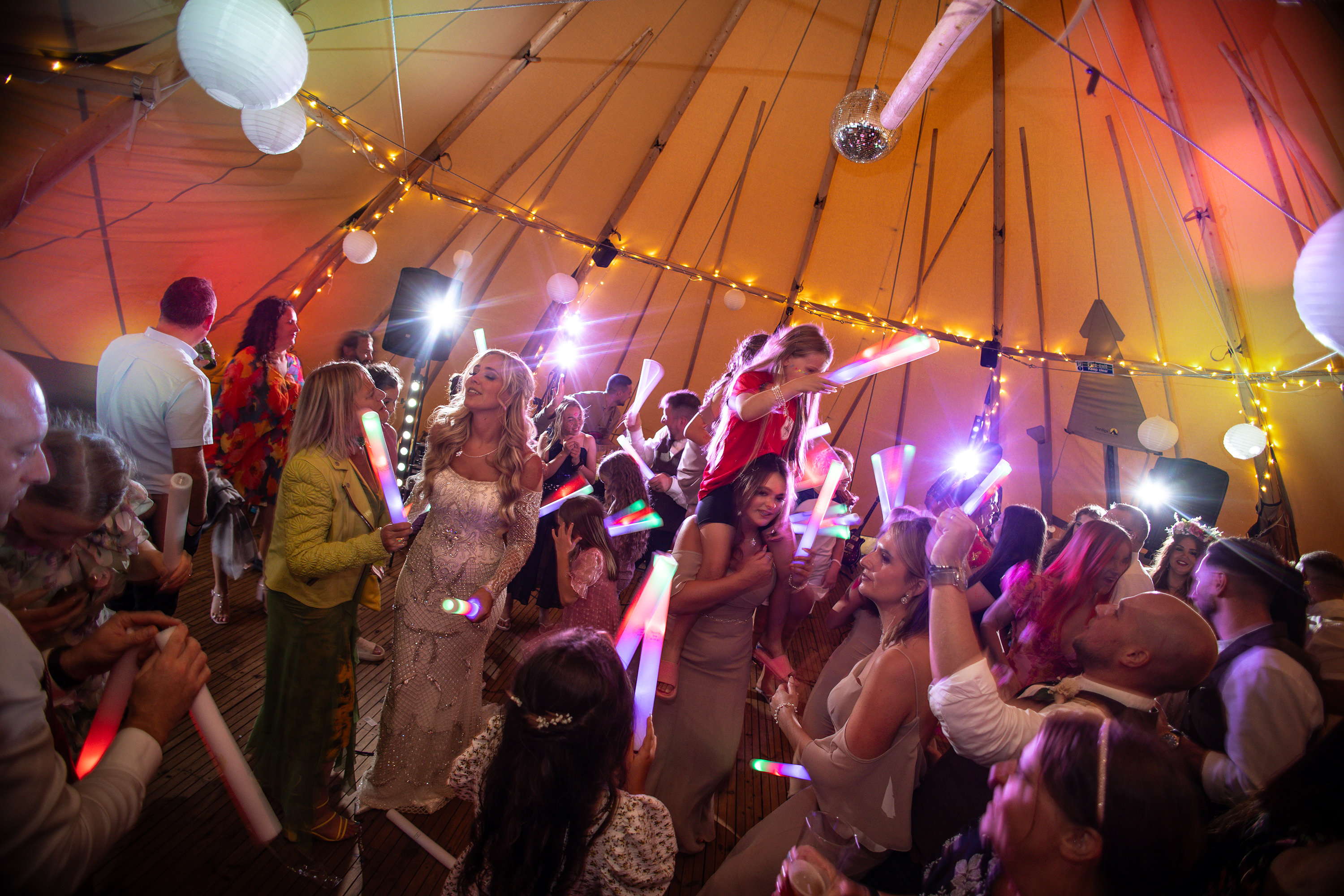 The evening party gets underway and everyone dances on the dance floor 