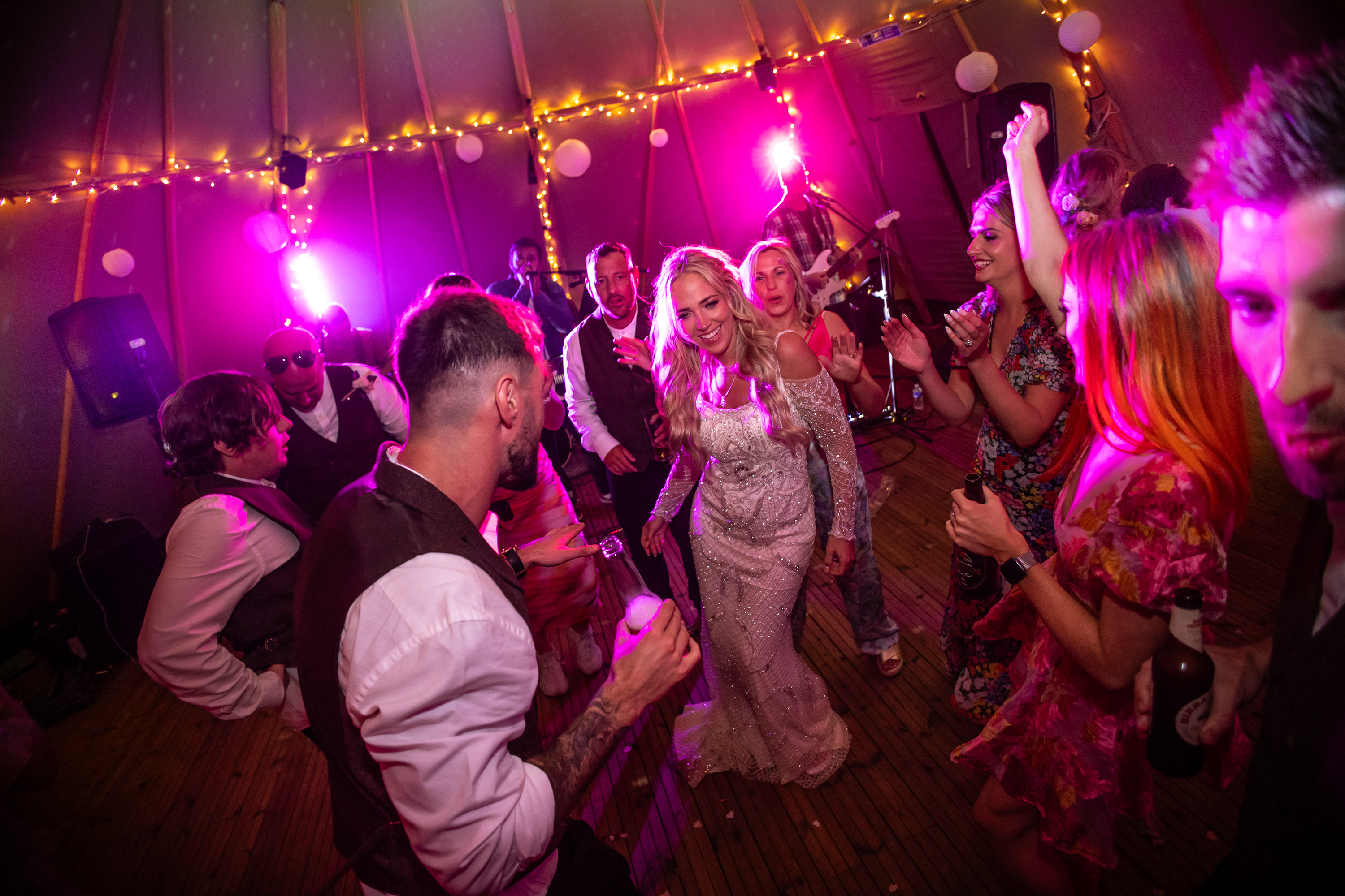 The Bride enjoying the party with her wedding guests 