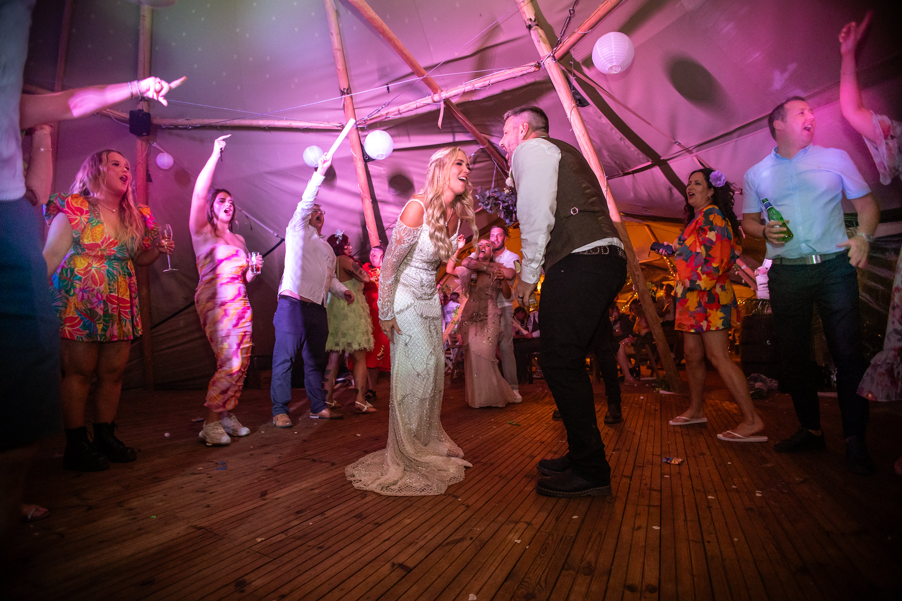 The wedding party in full swing everybody enjoying themselves 
