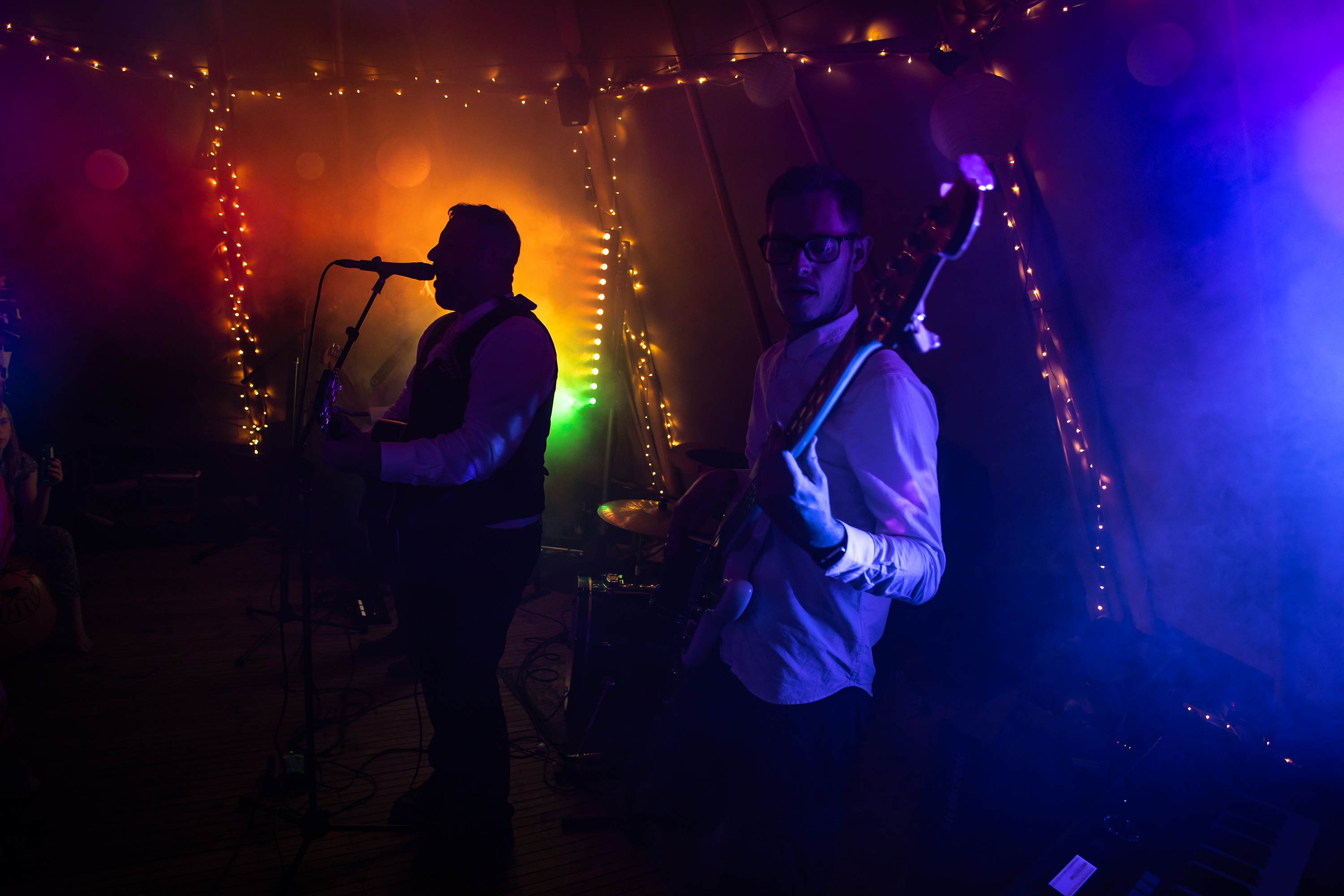 The groom plays the guitar and sings a song 