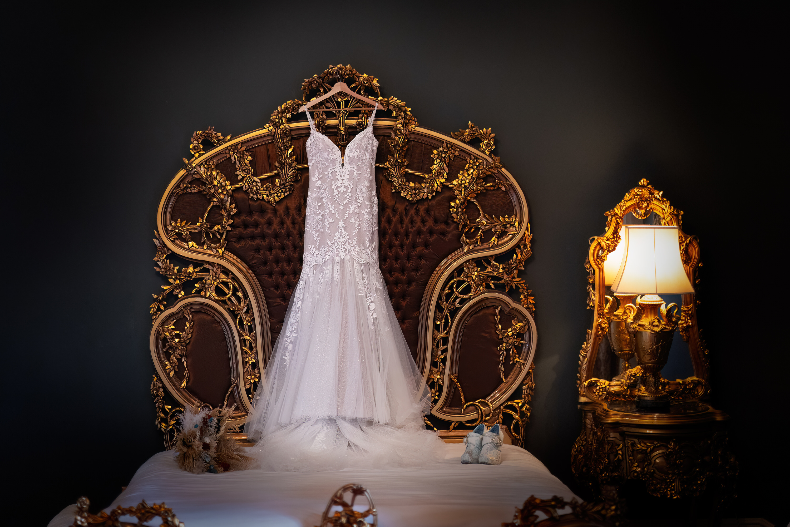 The wedding dress hanging over The Bridal bed 