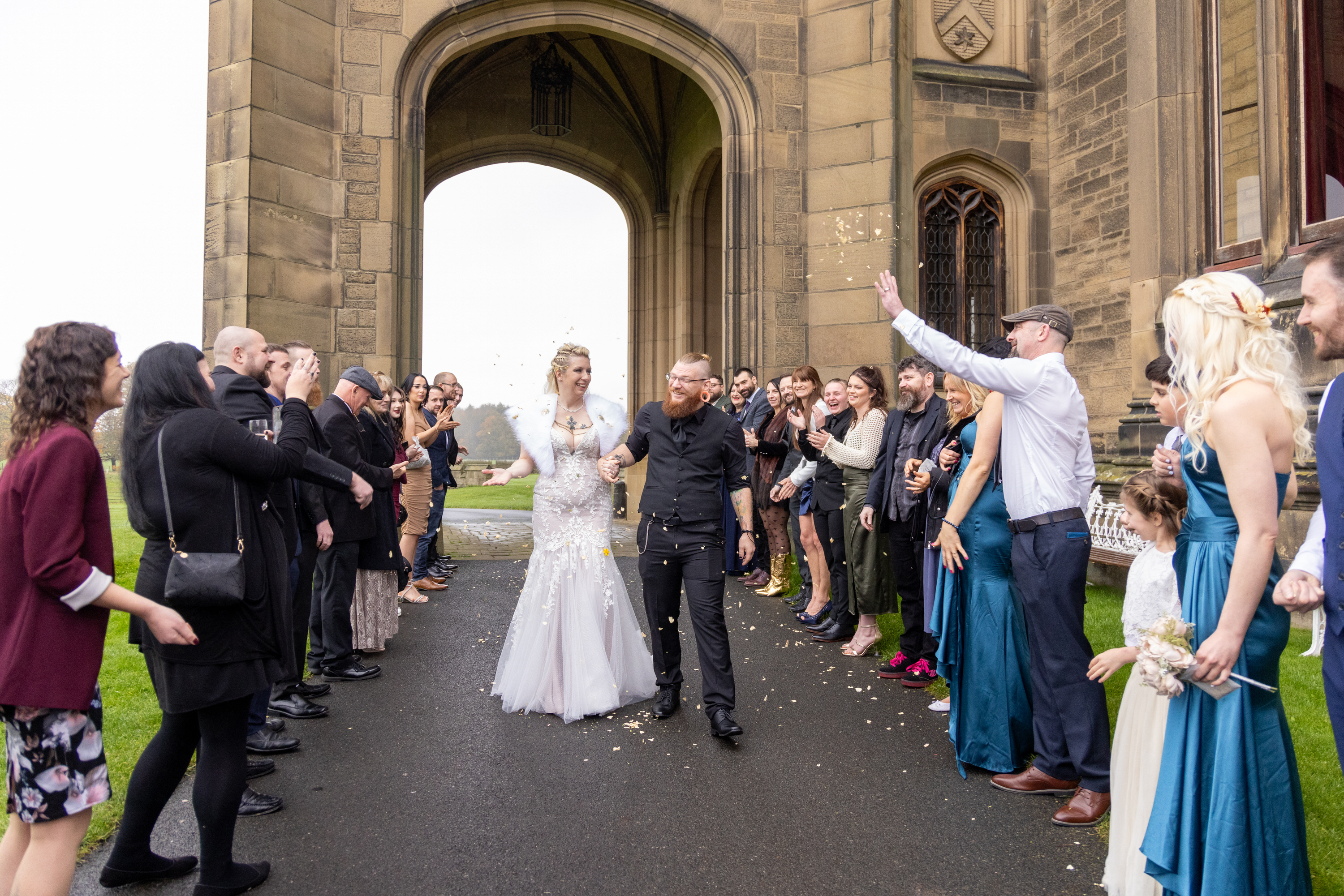  The wedding guests throw confetti at the bride and groom 