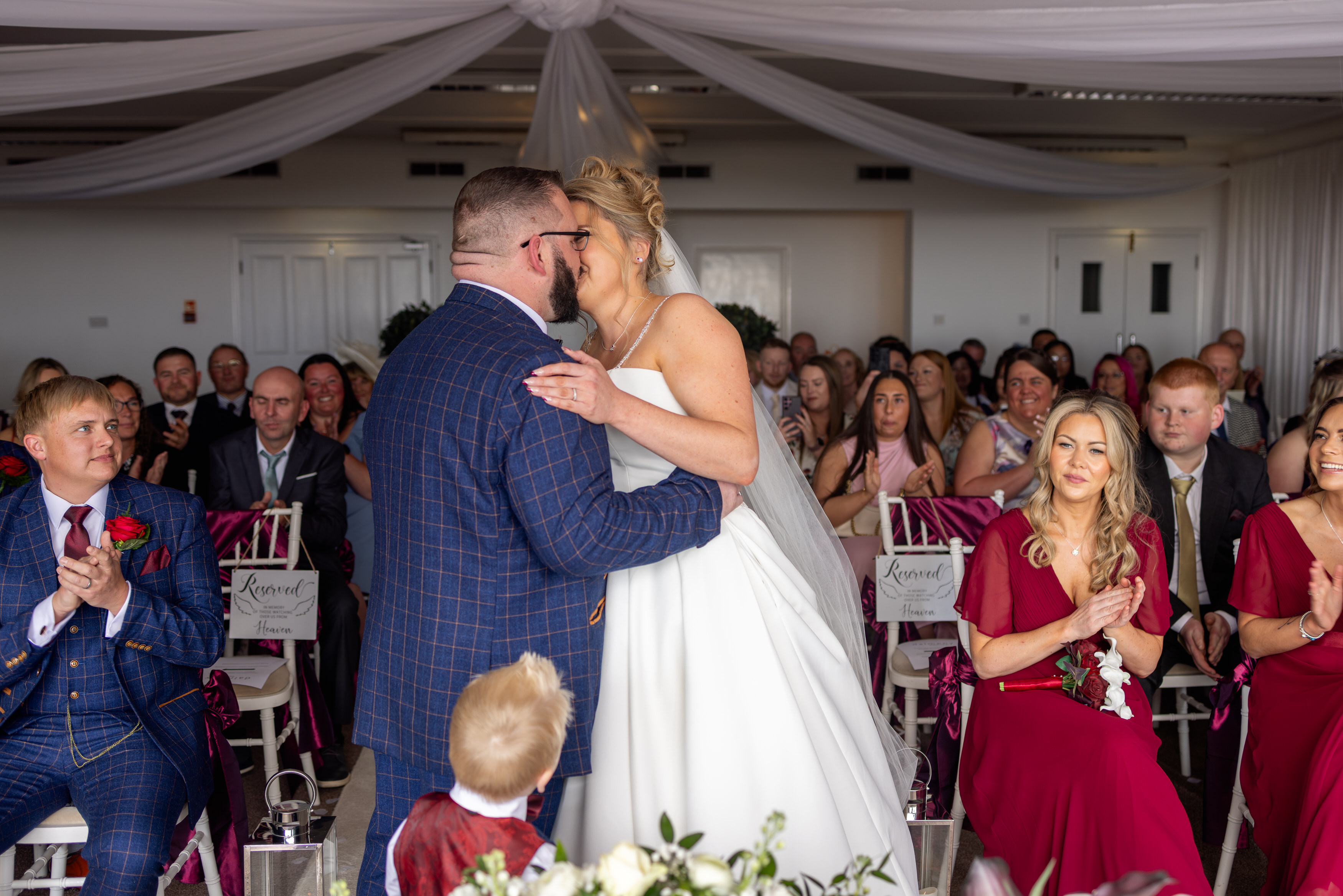 The bride and groom seal their wedding with a kiss