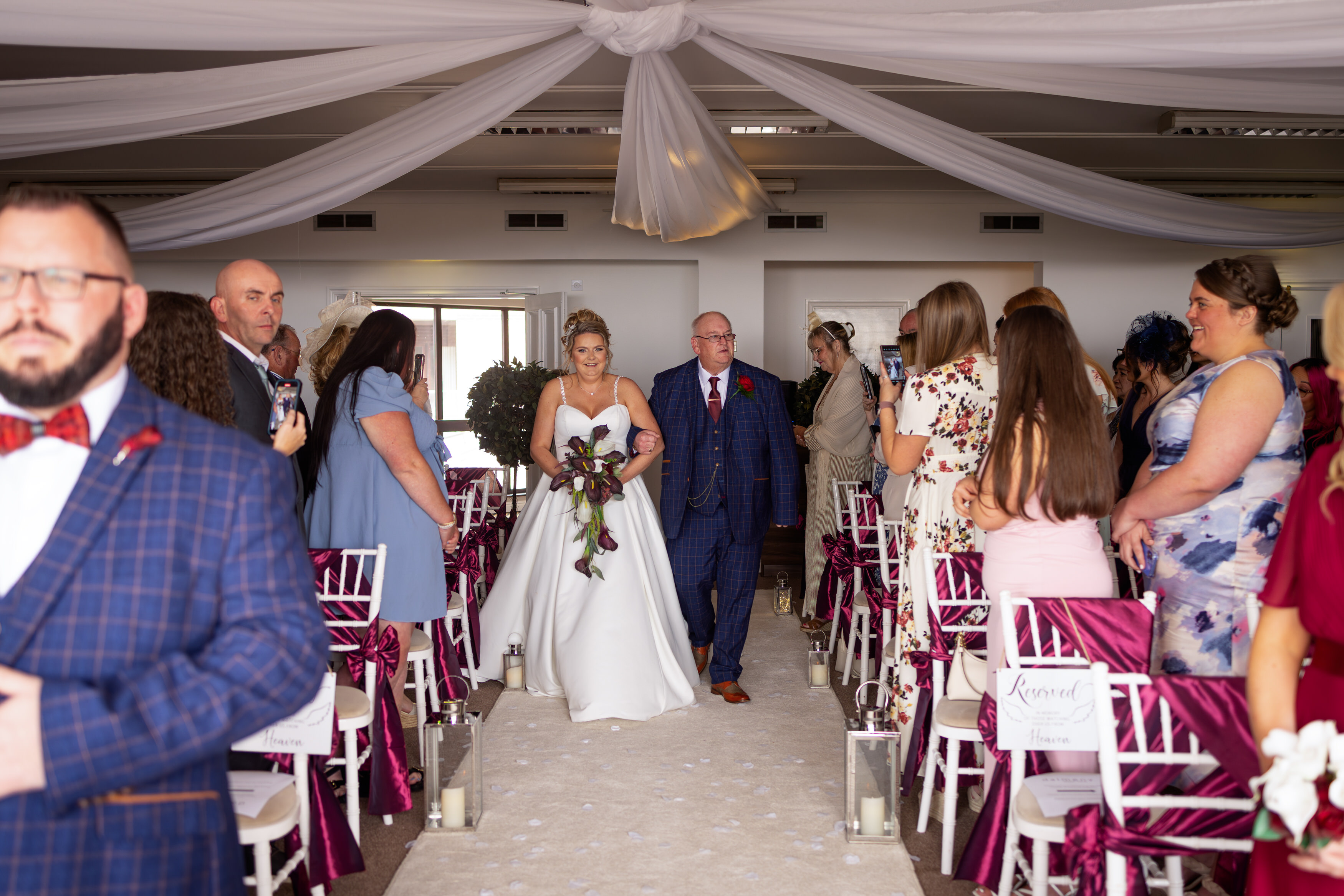The bride and her father walked down the aisle 