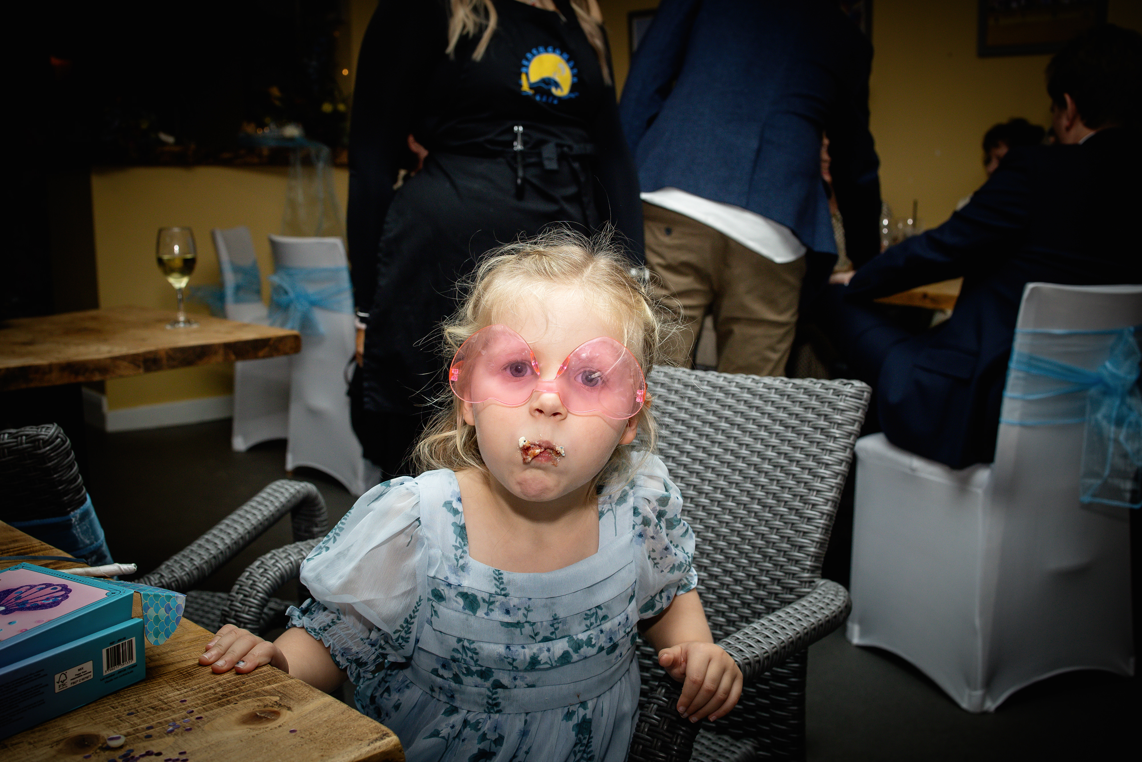 Little girl eating wedding cake 
