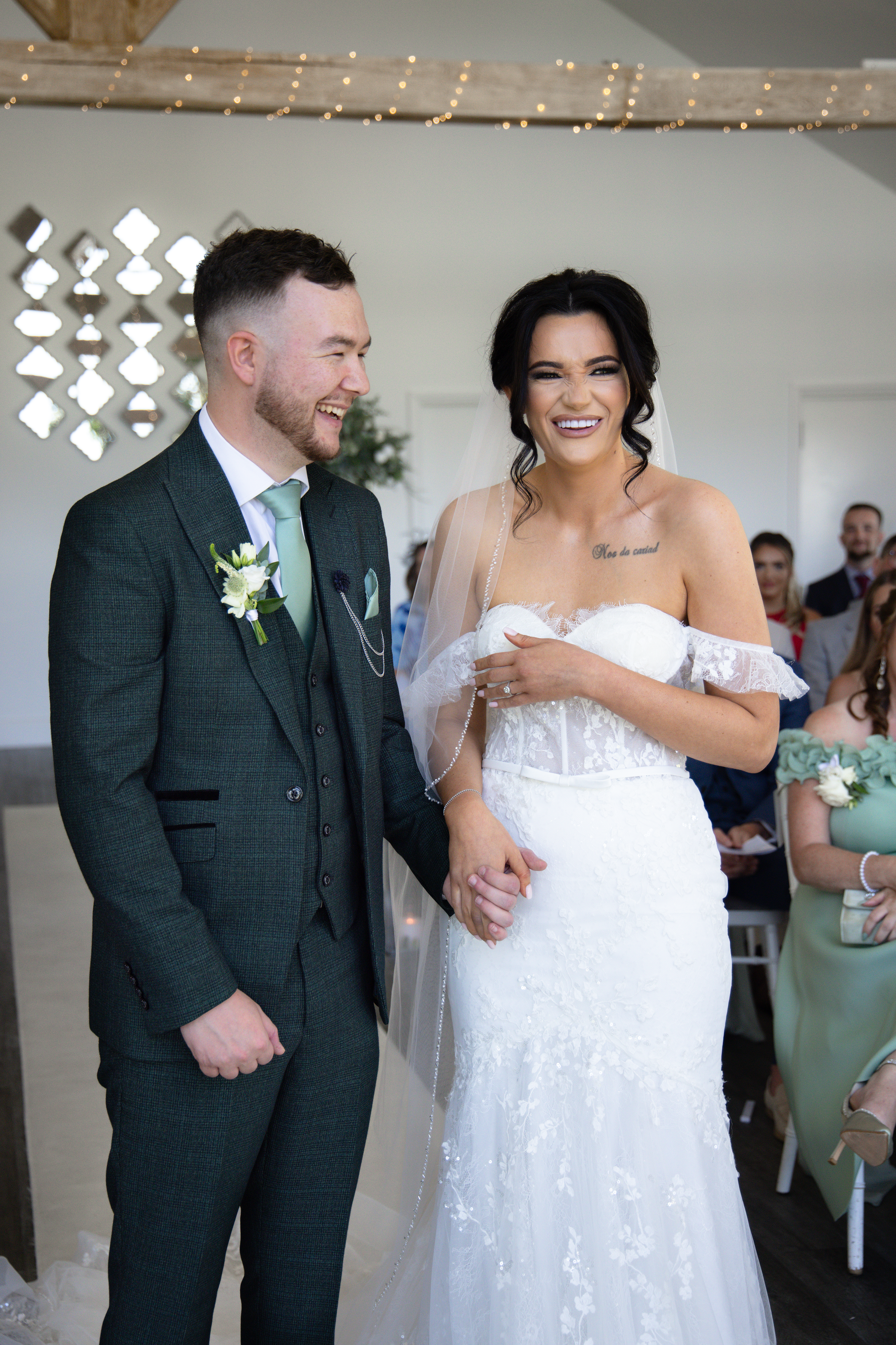 Christina and Nathan laughing on their wedding day 