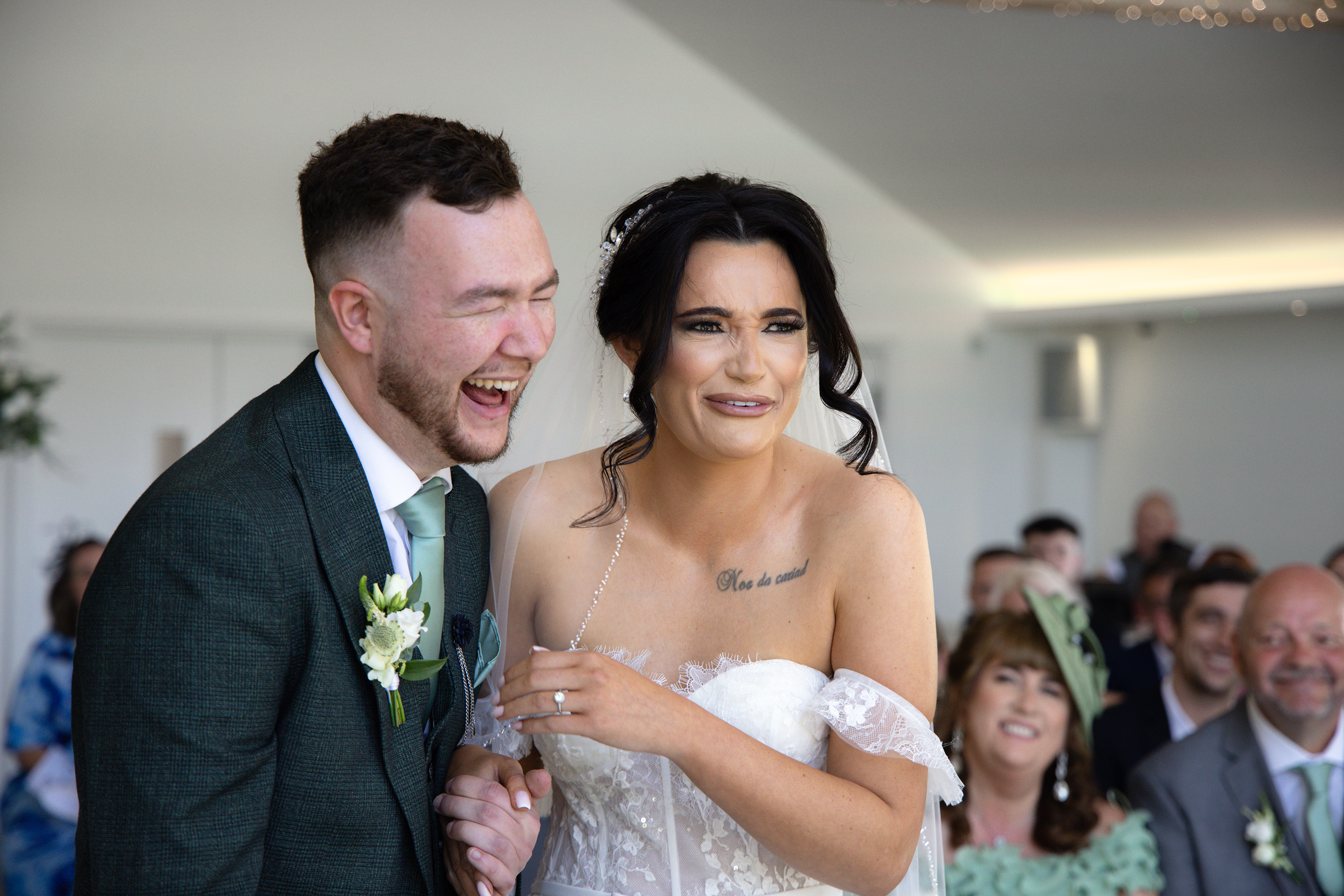 Christina and Nathan laughing on their wedding day 