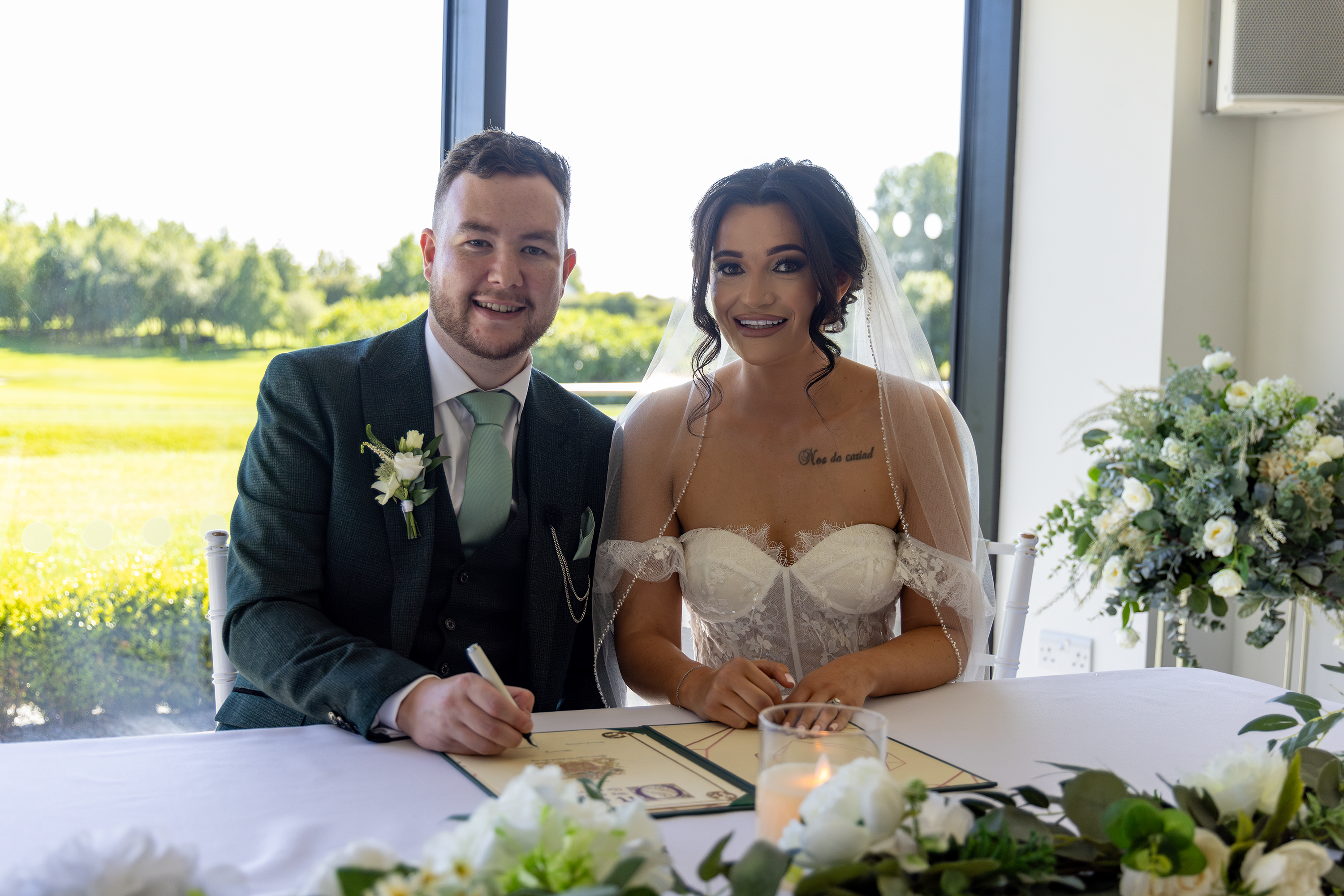 The bride and groom signed the wedding register 