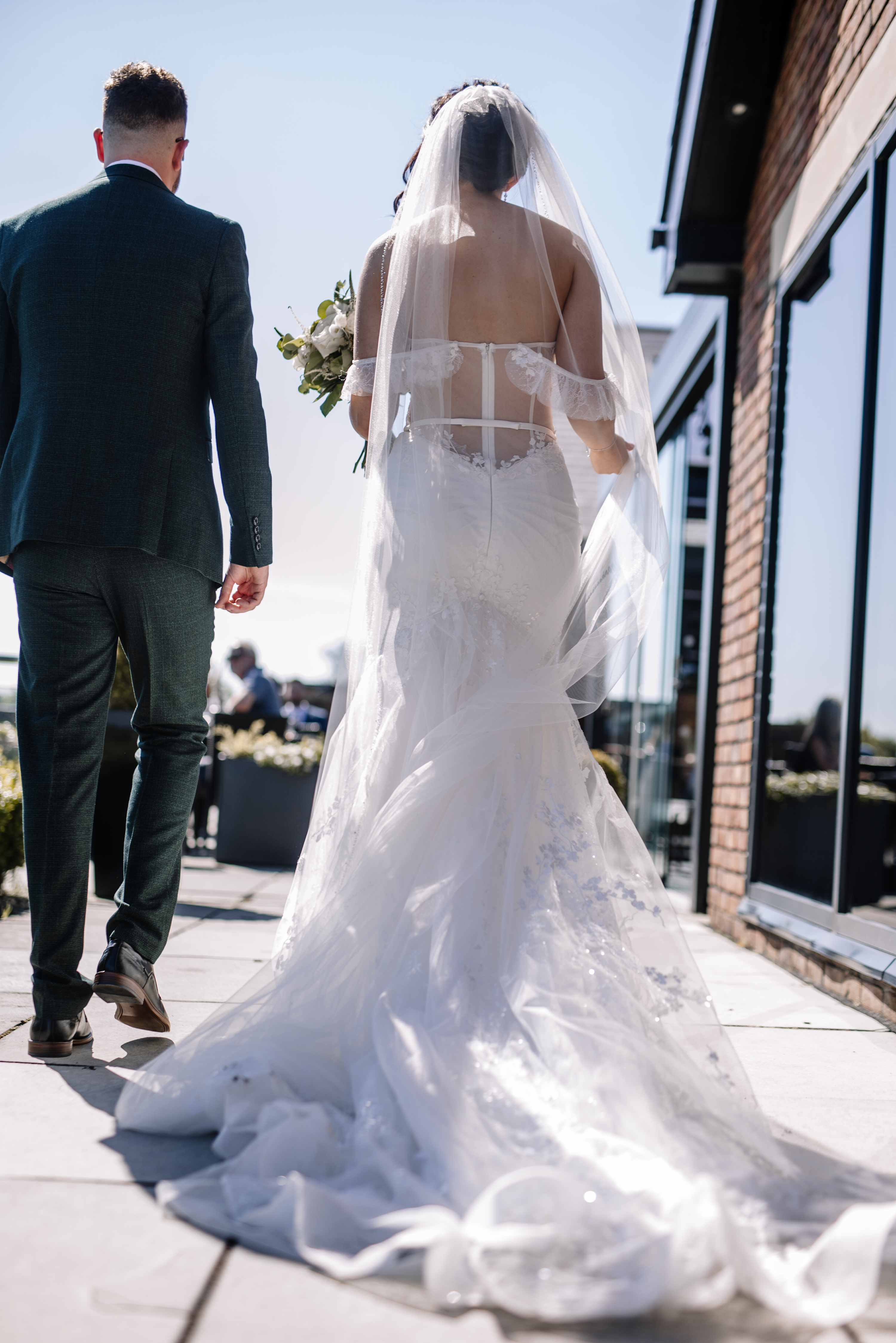 The bride and groom walking away 