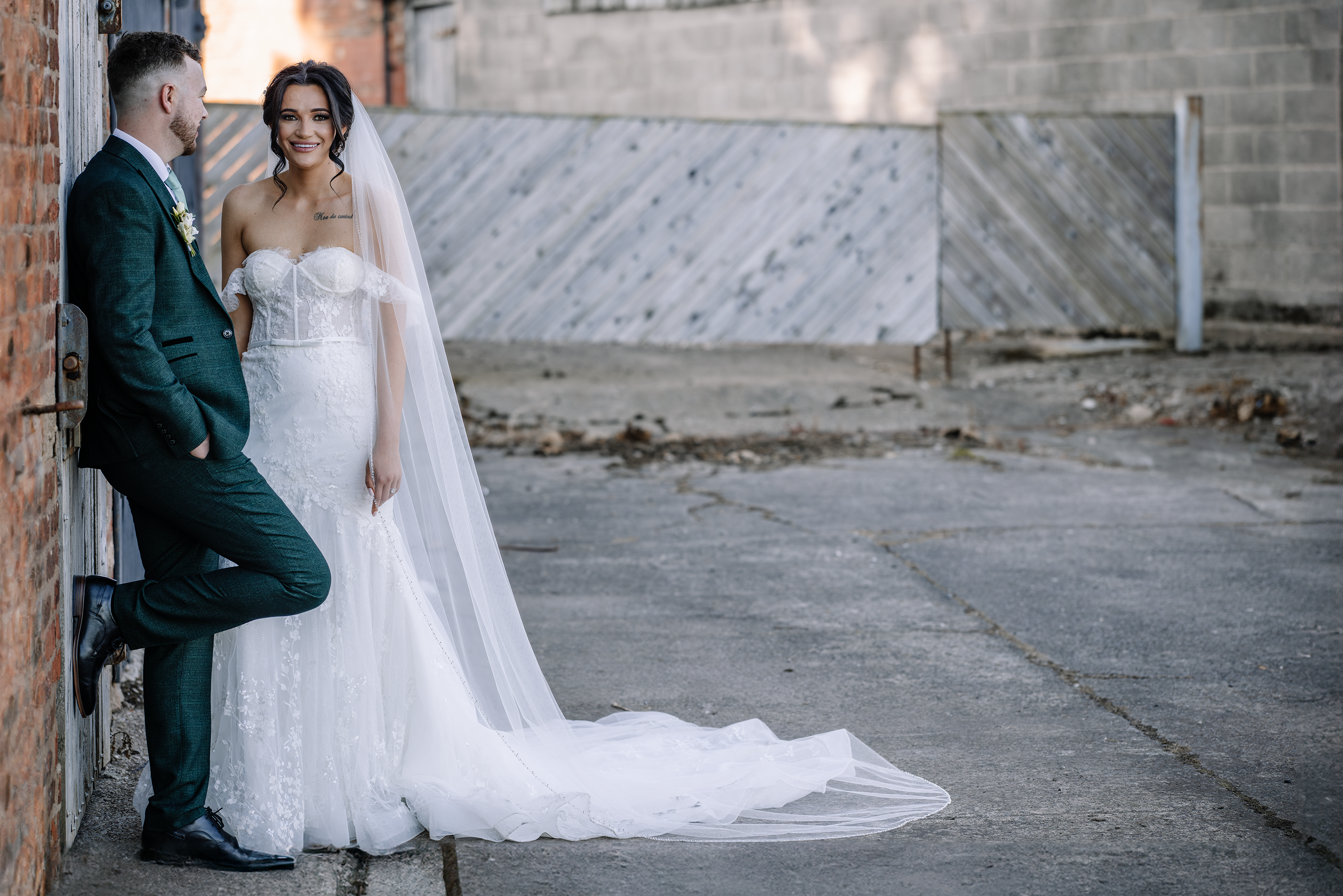 The bride and groom pose for wedding photos 
