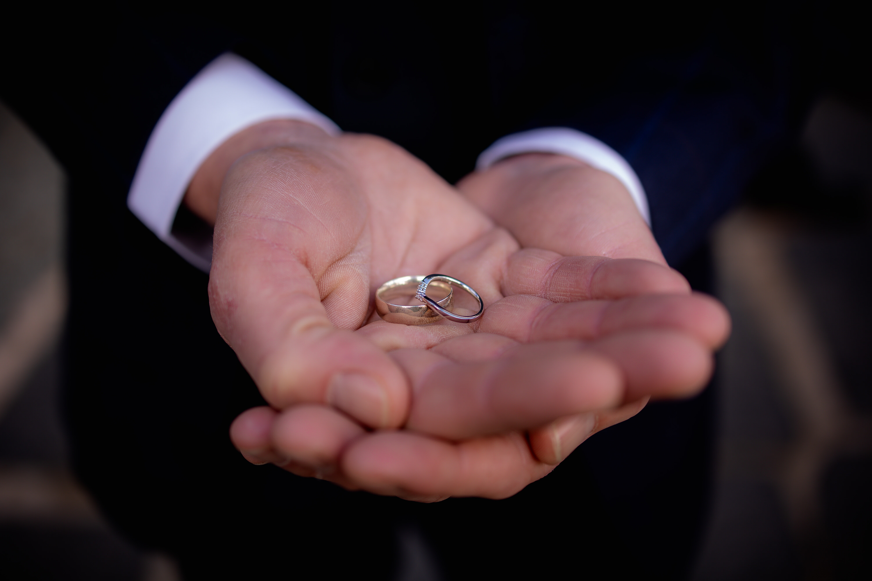 The best man holding the wedding rings 
