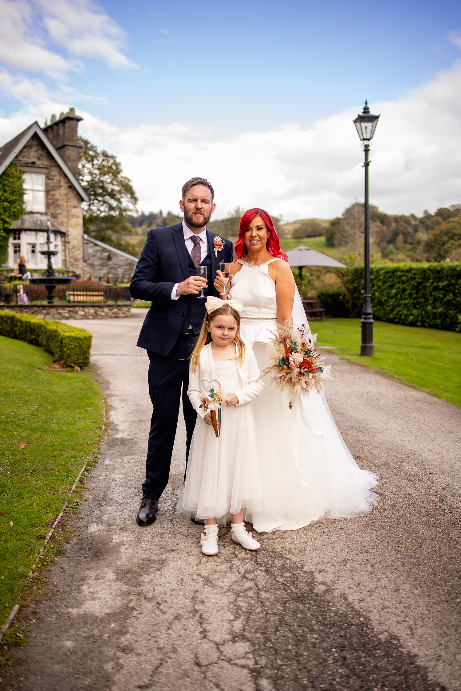 The bride and groom with their daughter 