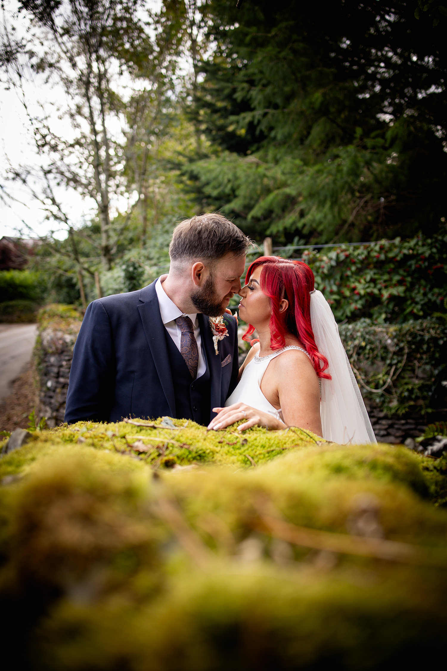 Stacy and Luke have a kiss at the stone wall 