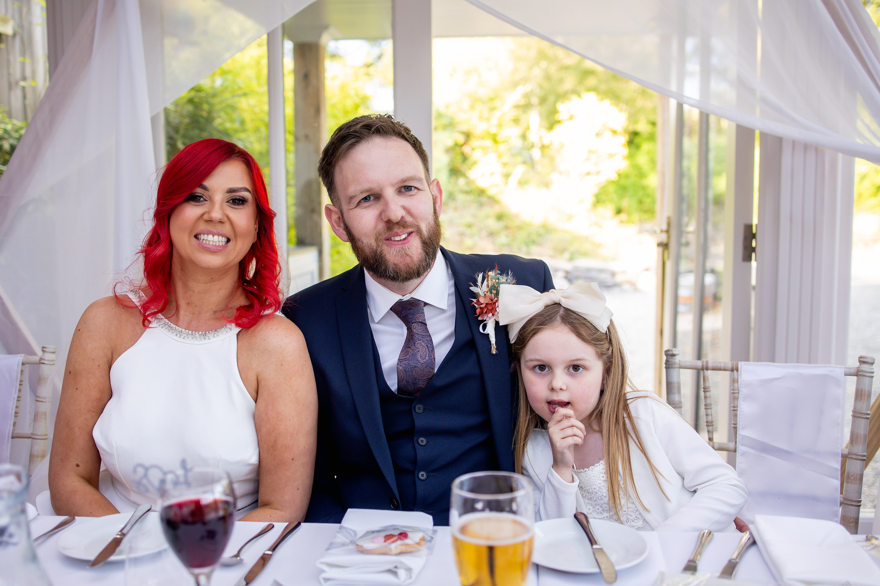 The bride and groom sit down for their wedding breakfast 