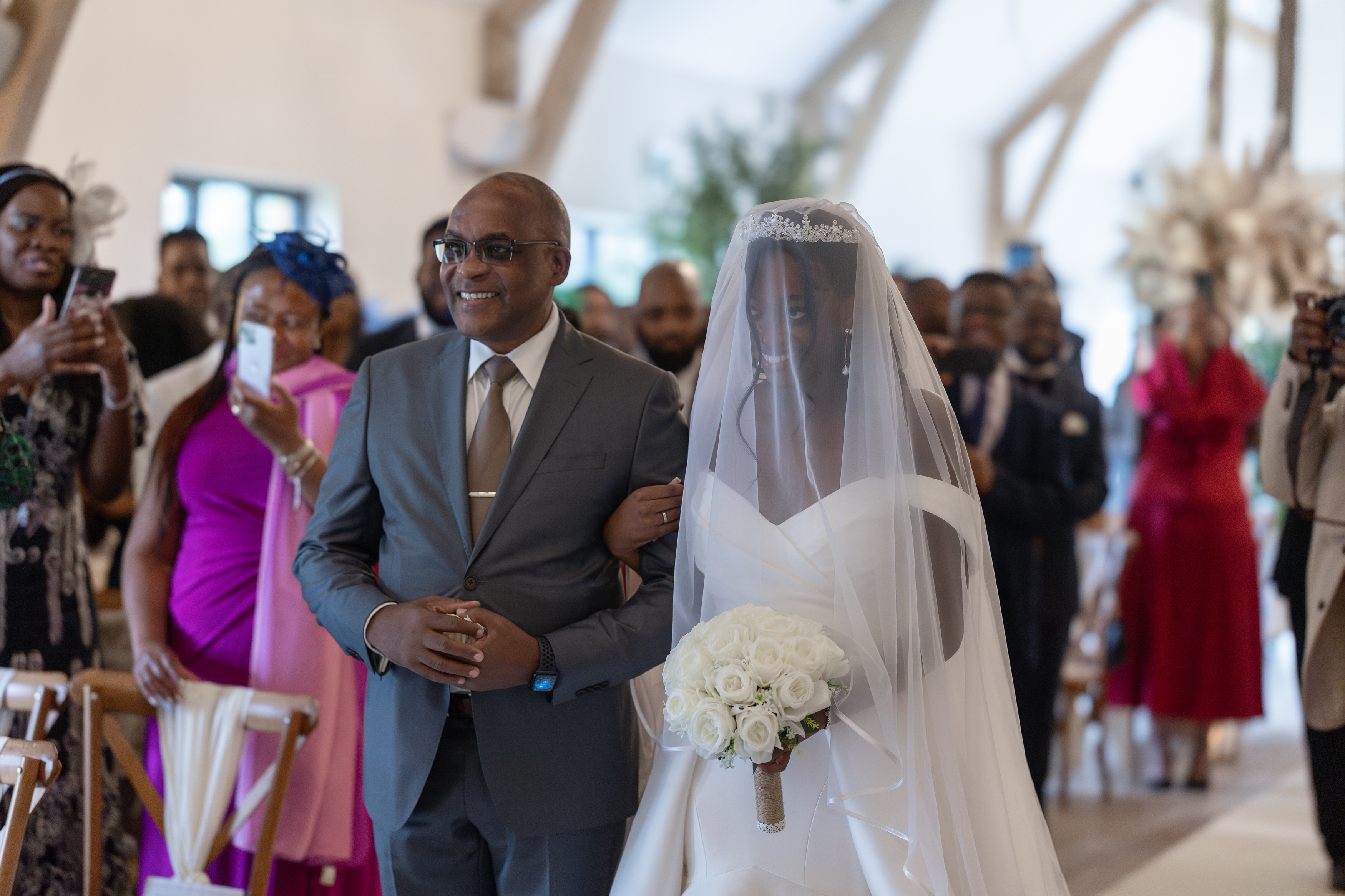The father hands his daughter over to her husband to be