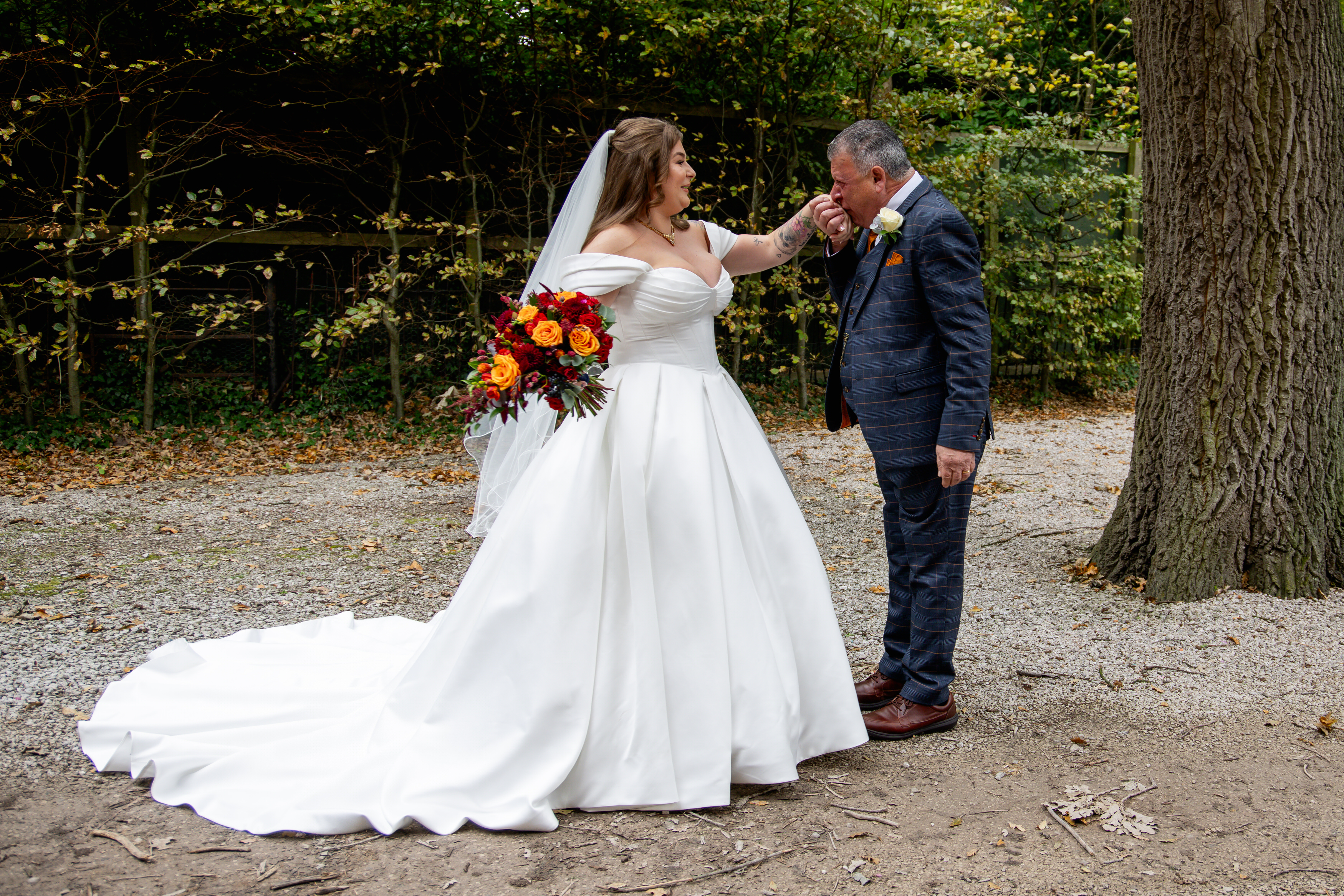 The brides father sees his daughter in her wedding dress for the first time 