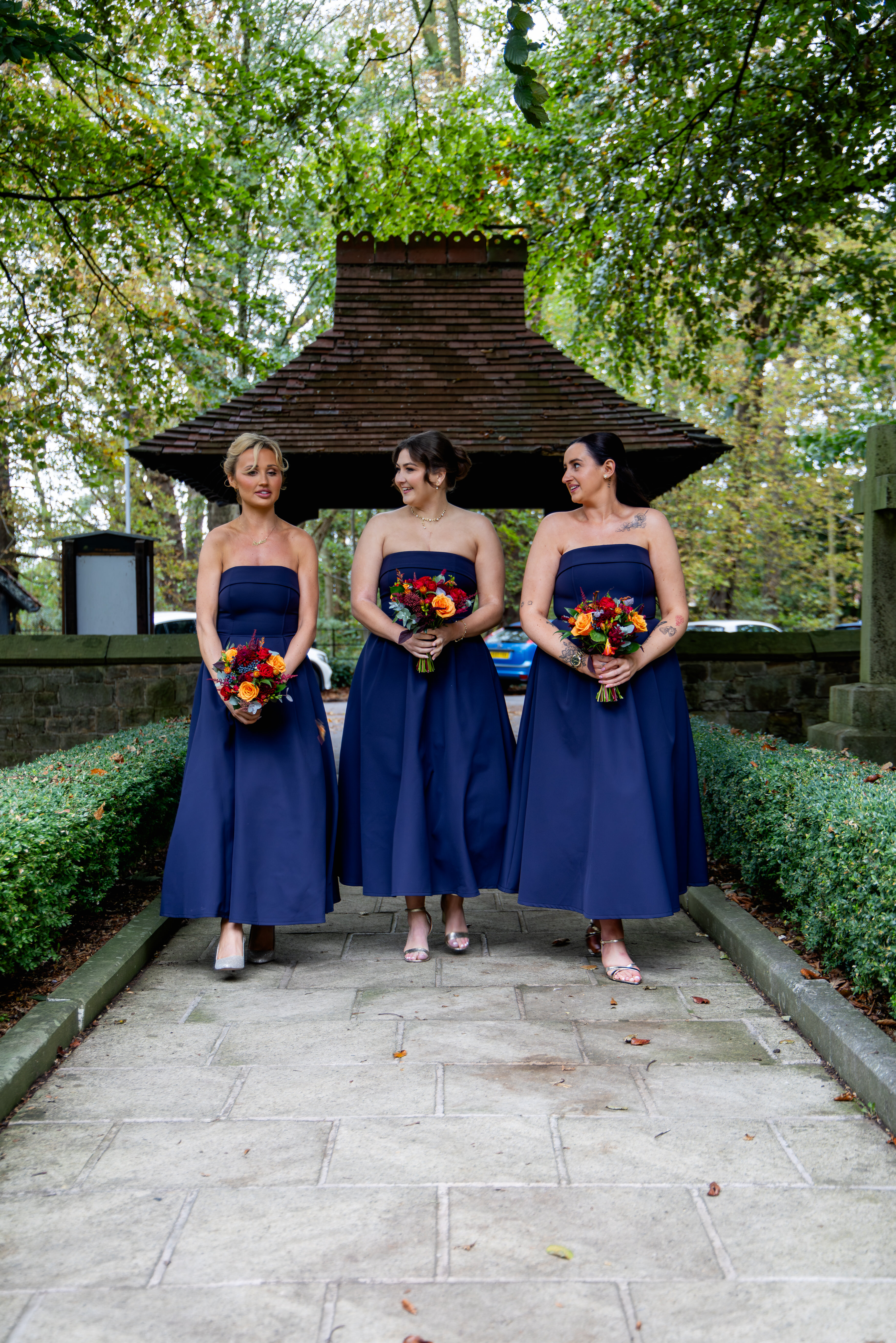 The bridesmaids arriving at the church 
