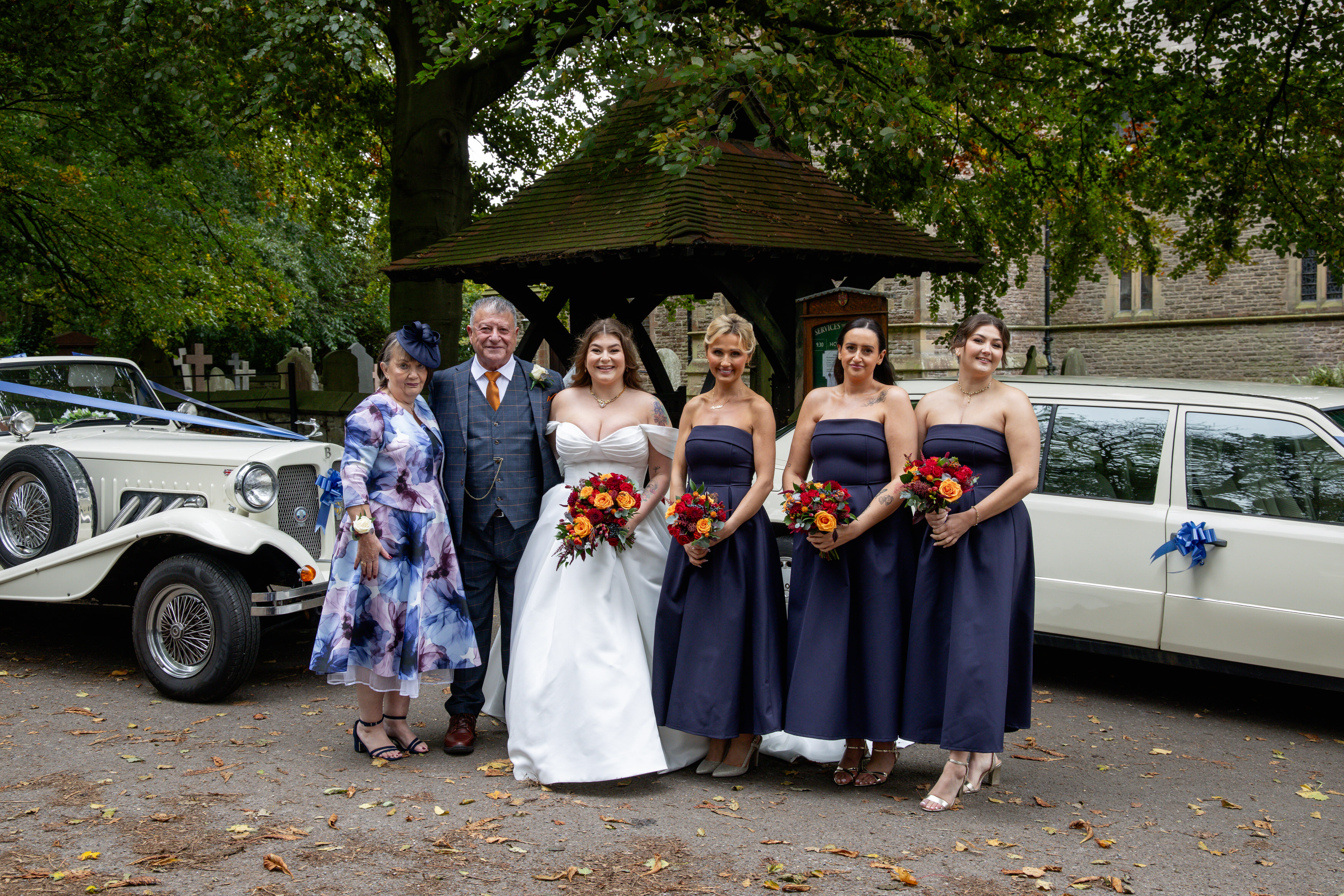 The bride and her mother and father and bridesmaids  before going into the church