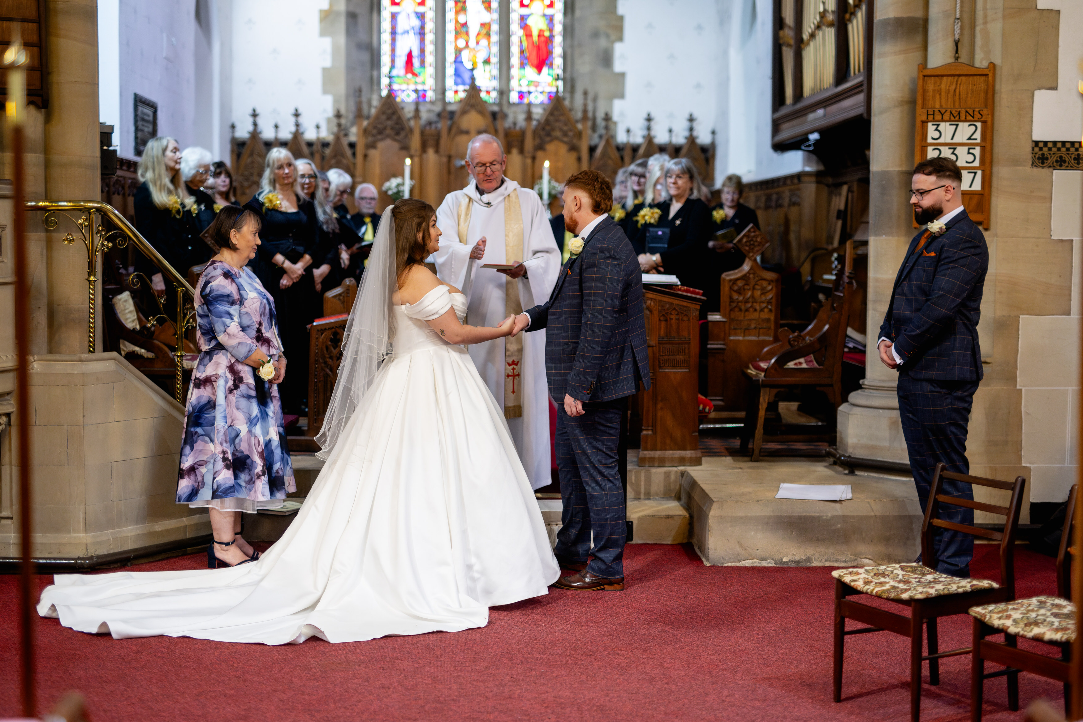 The bride and grooms say their wedding vows 