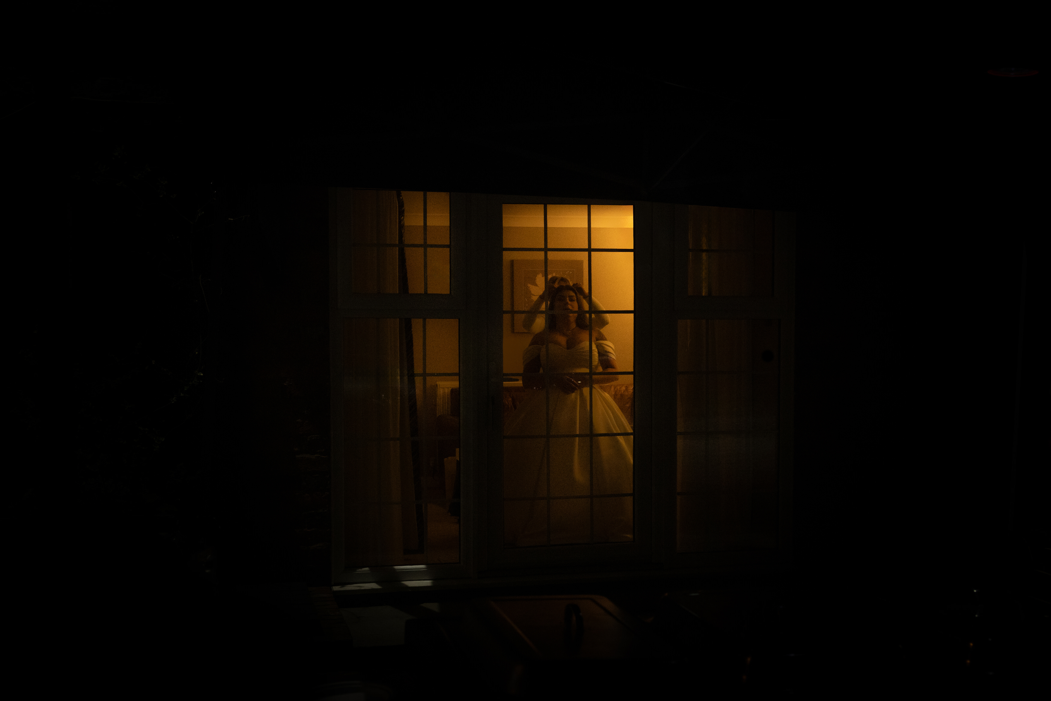 The Bride having her hair tied up for the evening celebrations 