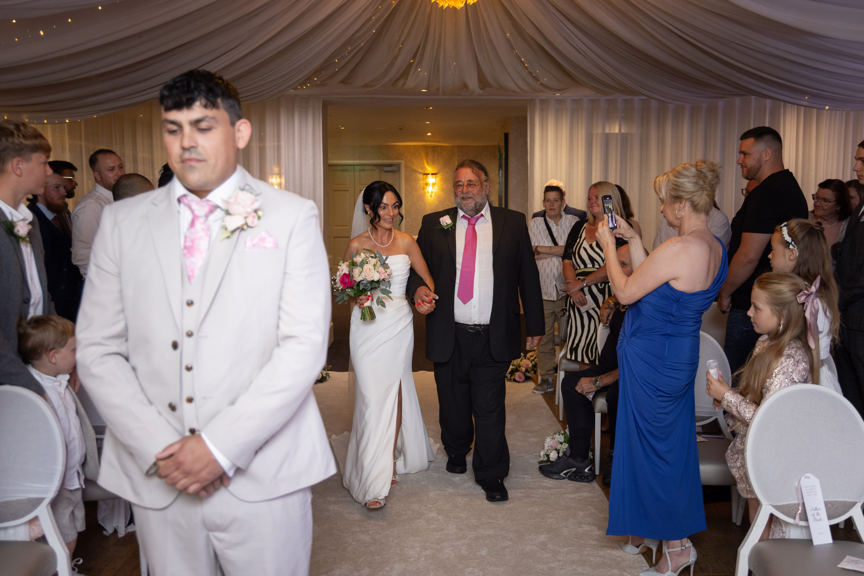The Bride being walked down the aisle by her father 