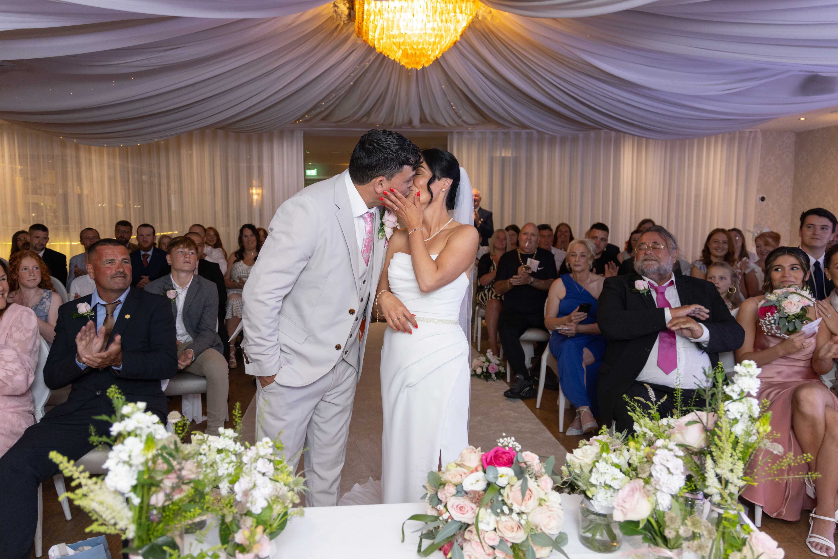 Sarah and Andrew seal their wedding with a kiss 